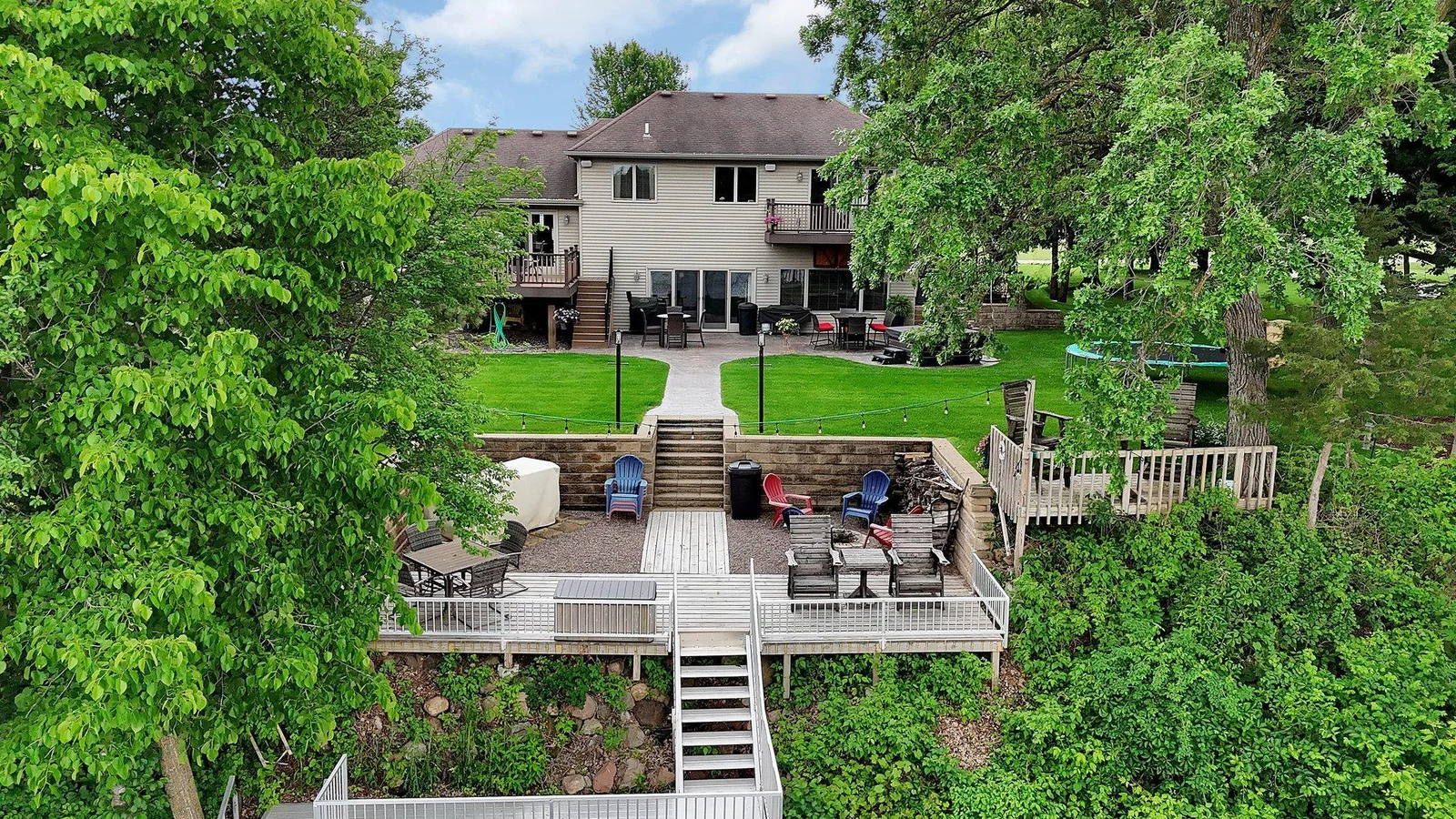 Enclosed stone entertainment area with access to the aluminum docking.