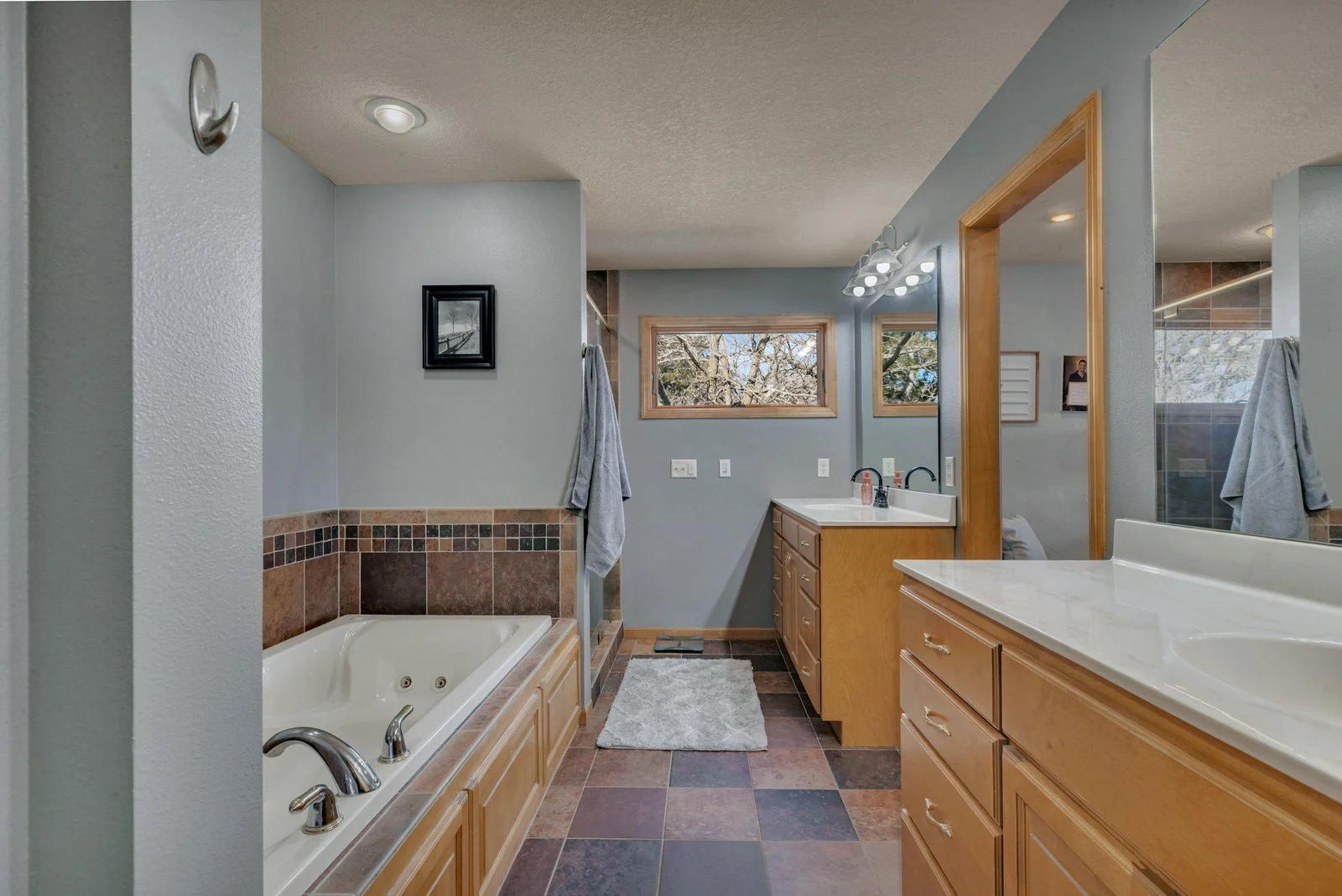 Private primary bathroom with a his and hers vanity.