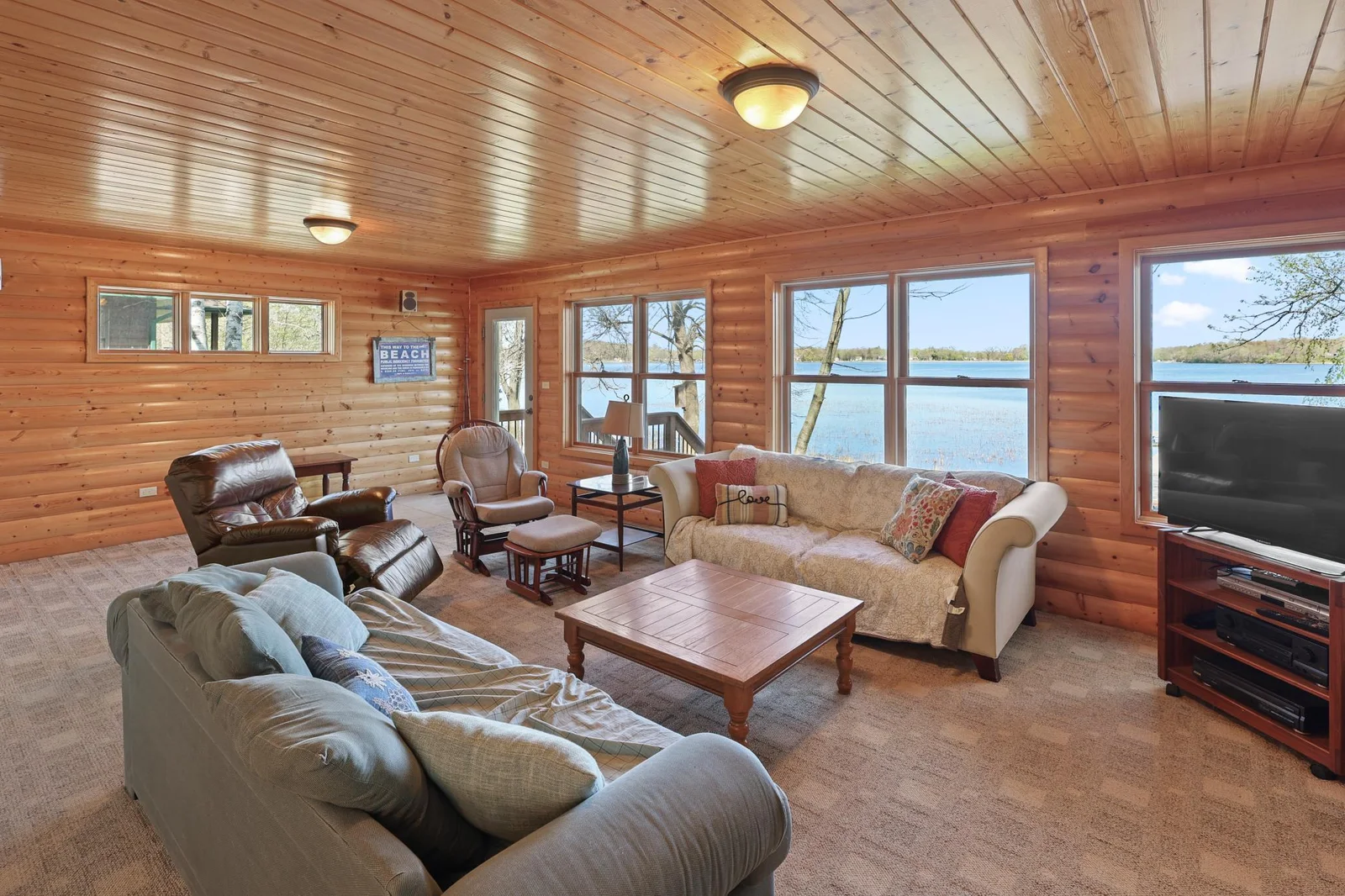 Living room area walks out to lakeside deck