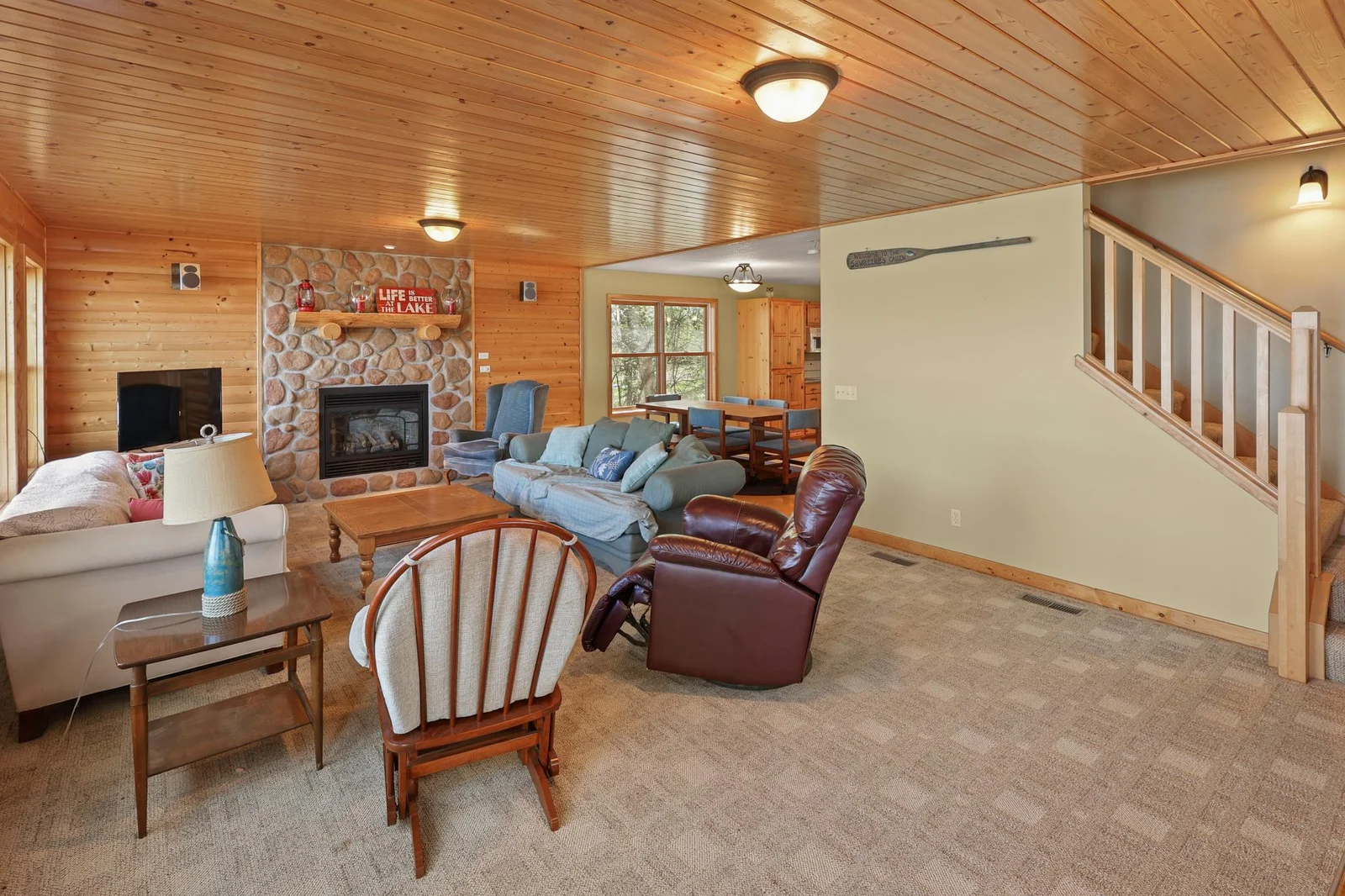 Family room looking into dining area. Nice tongue & groove ceiling.