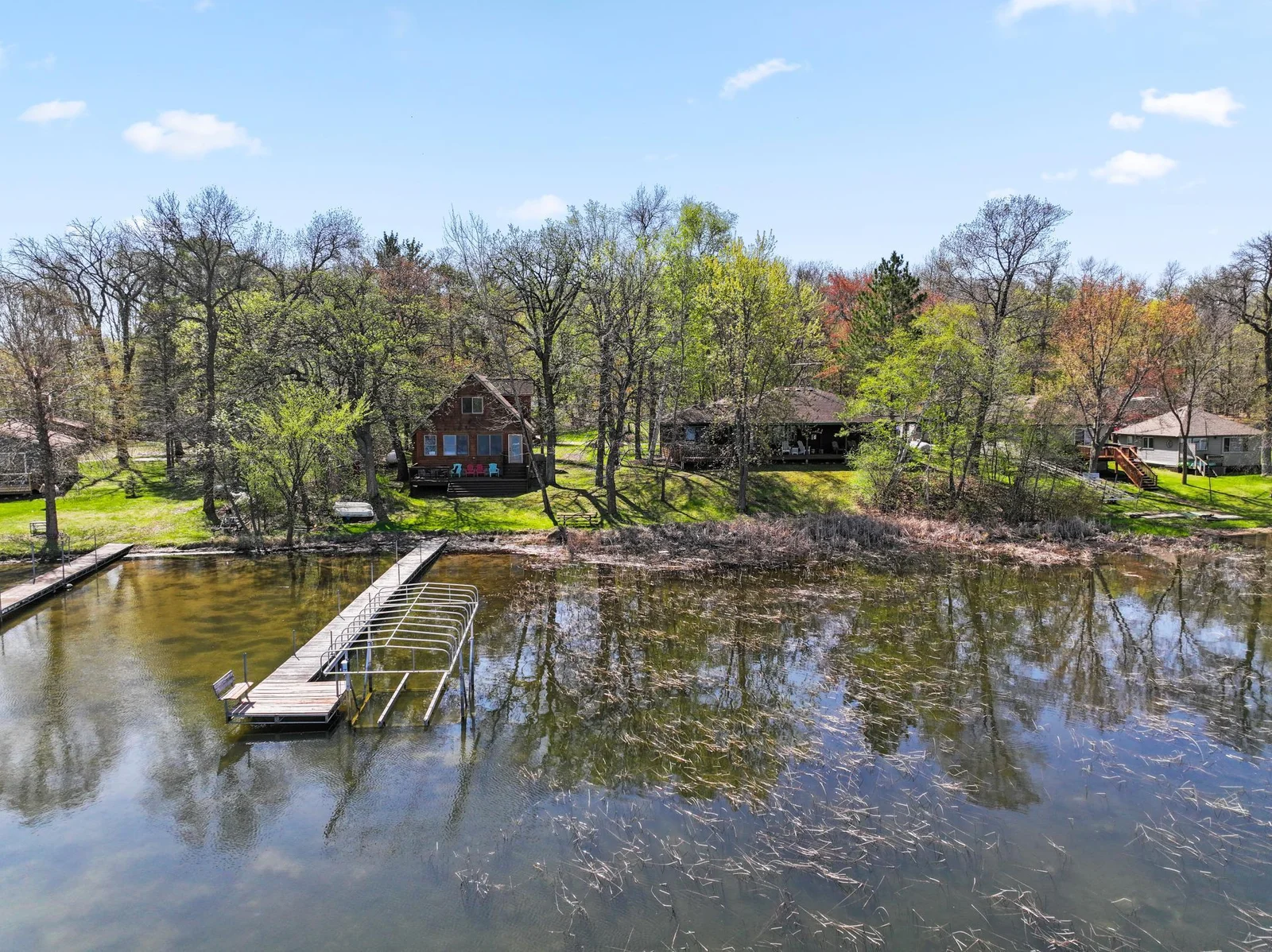 Two nice homes on 151 feet of hard sand bottom lake shore