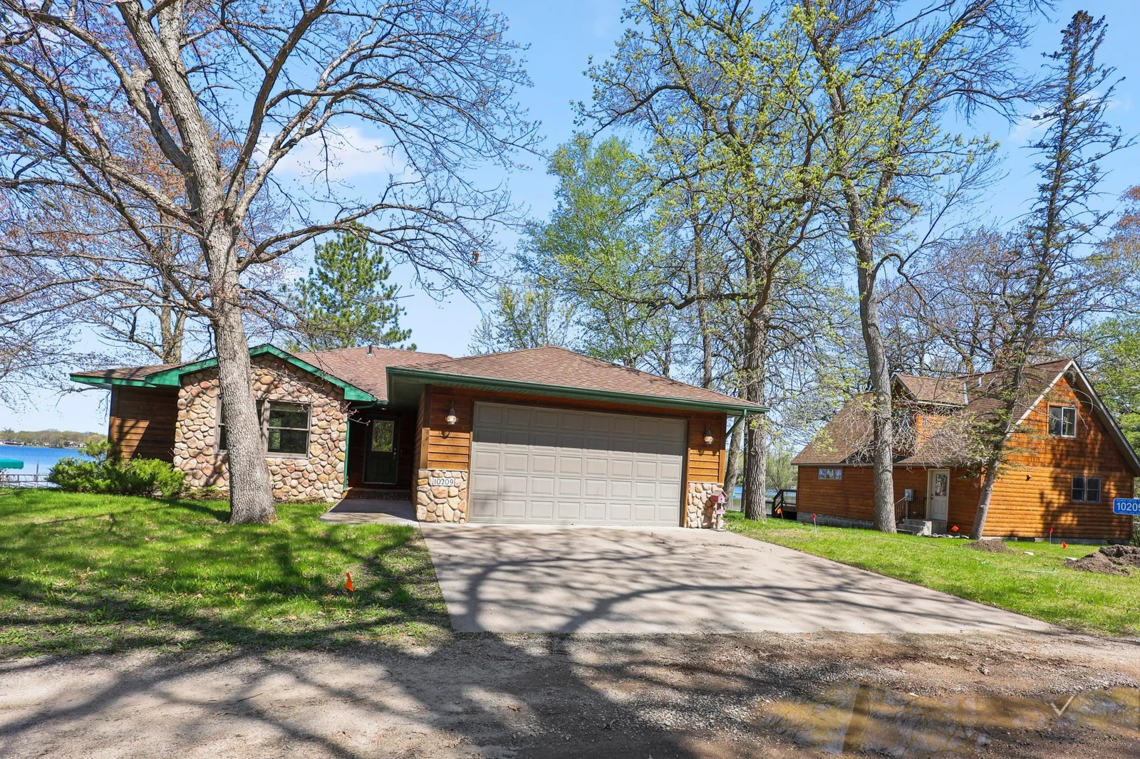 Attached double garage and stone siding