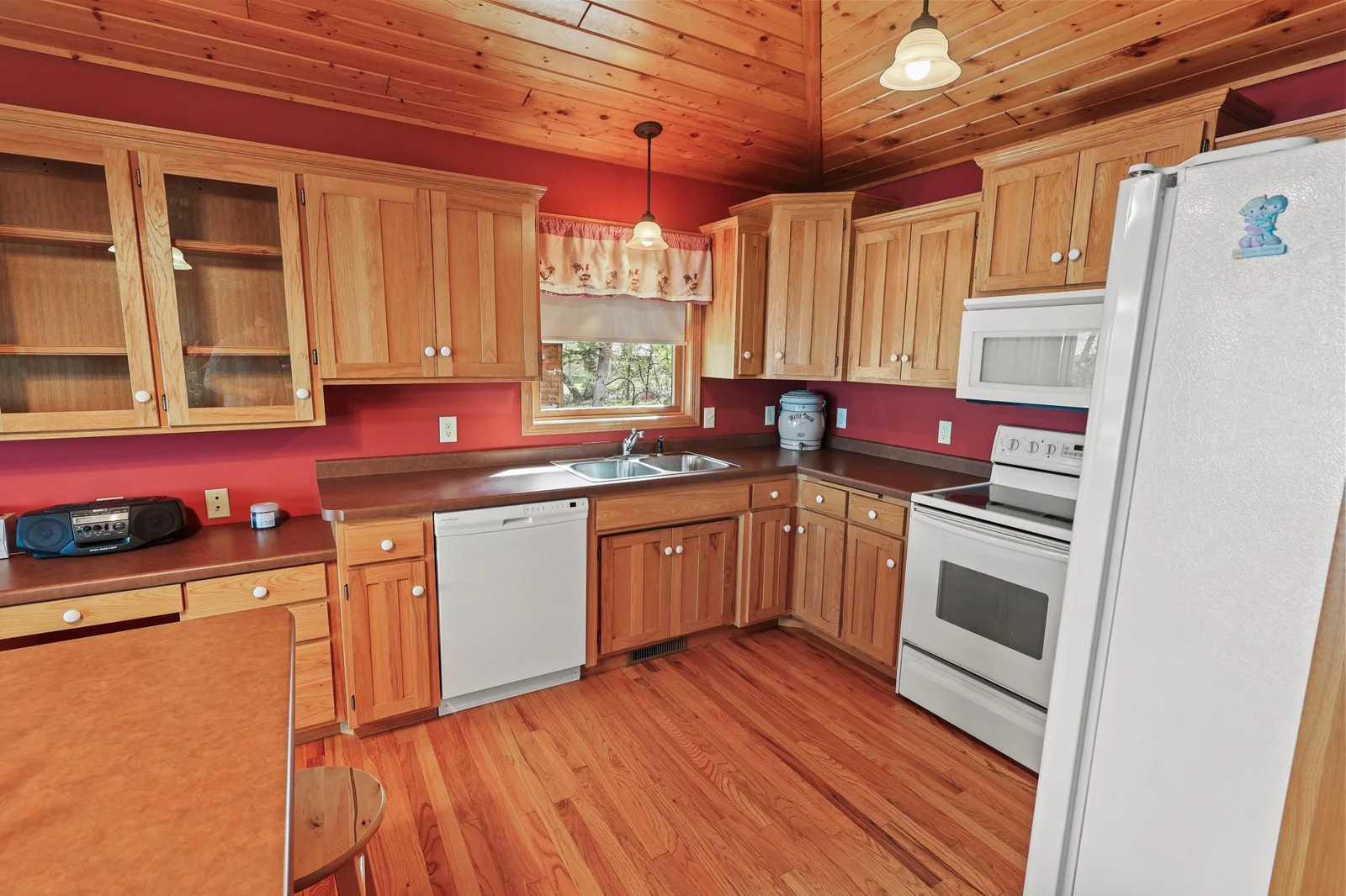 Kitchen with all appliances and beautiful tongue & groove pine ceiling.