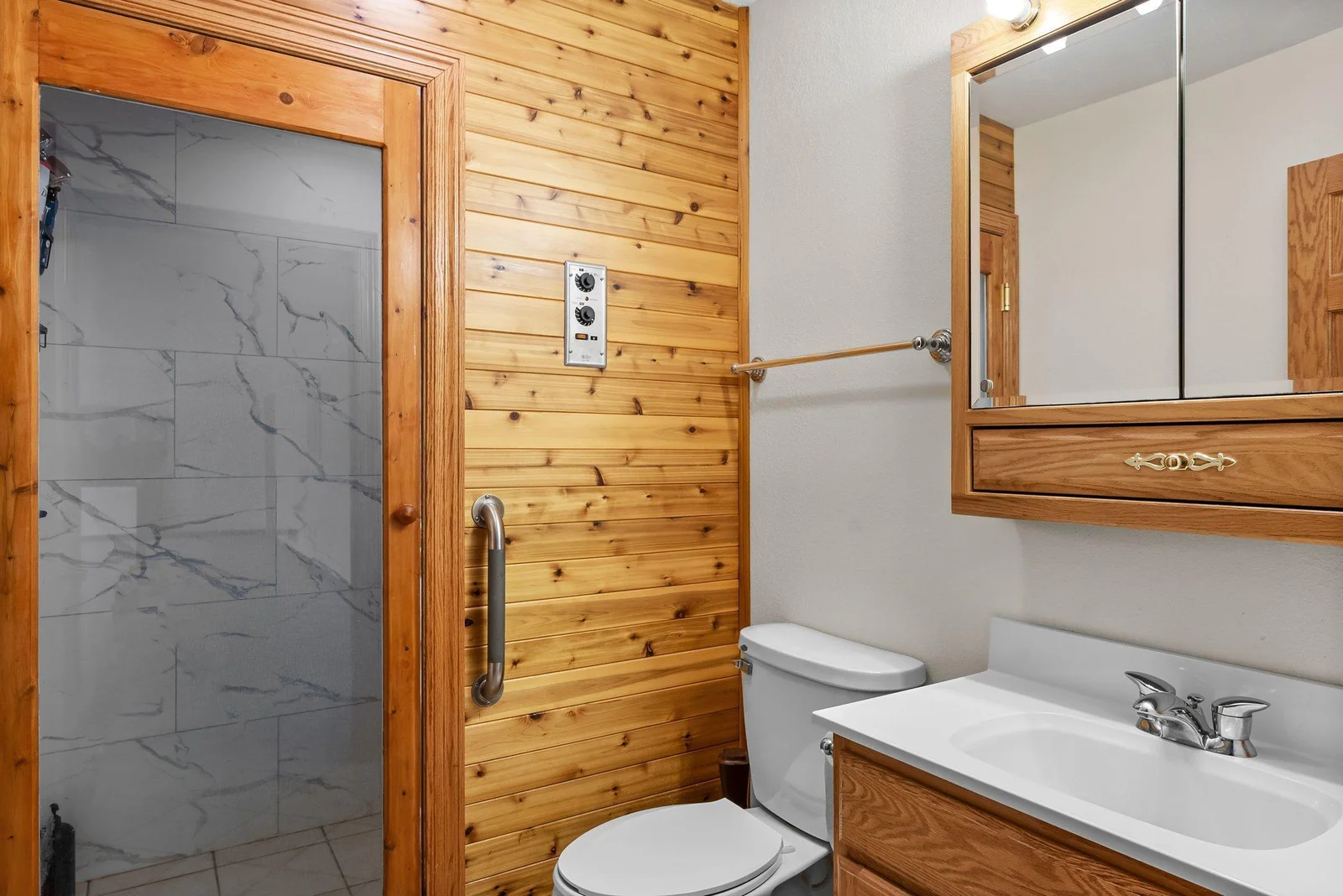 Lower level 3/4 bathroom (no tub, only shower). Sauna has been removed to accommodate a shower