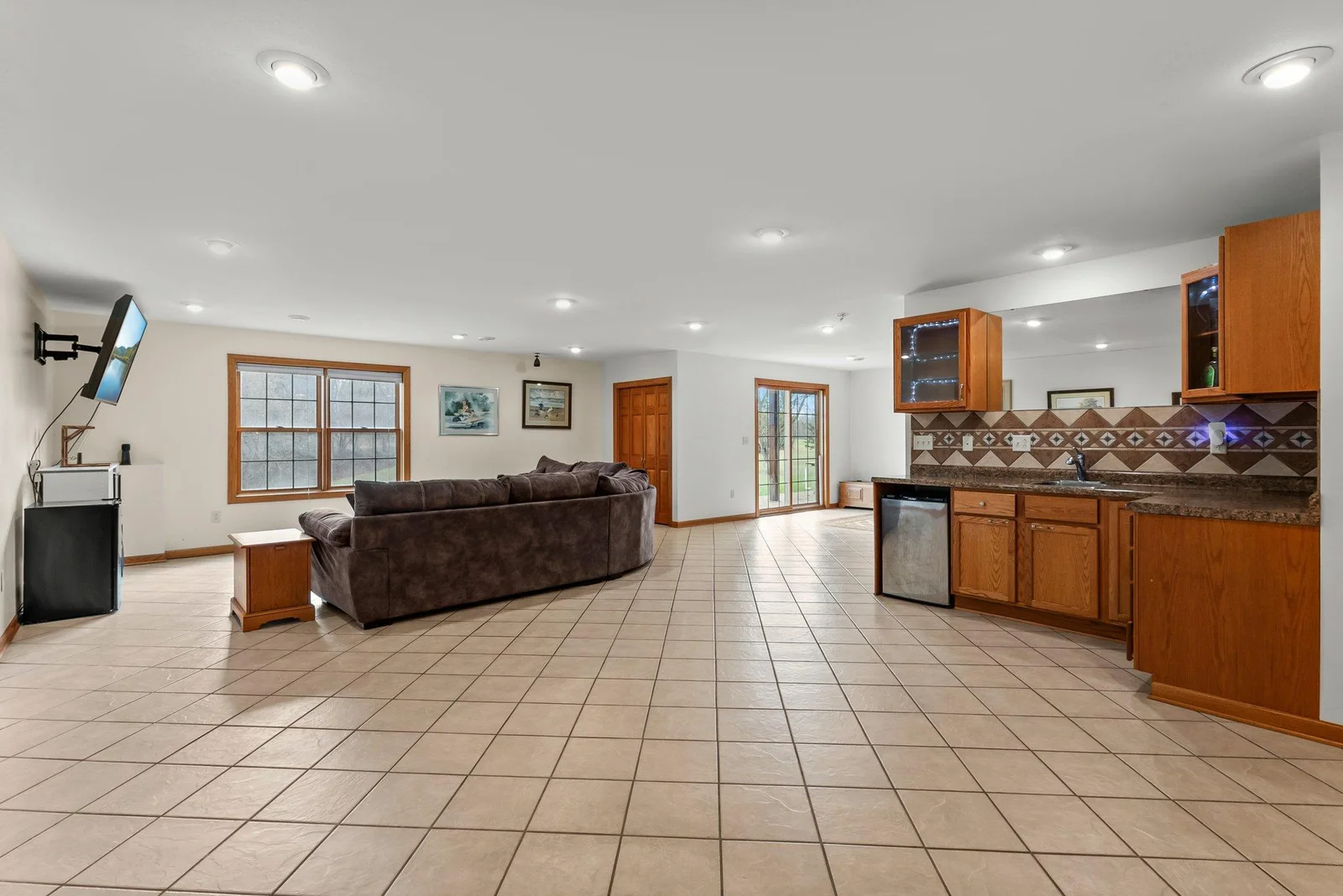 First family room in lower level with entertainment area/wet bar