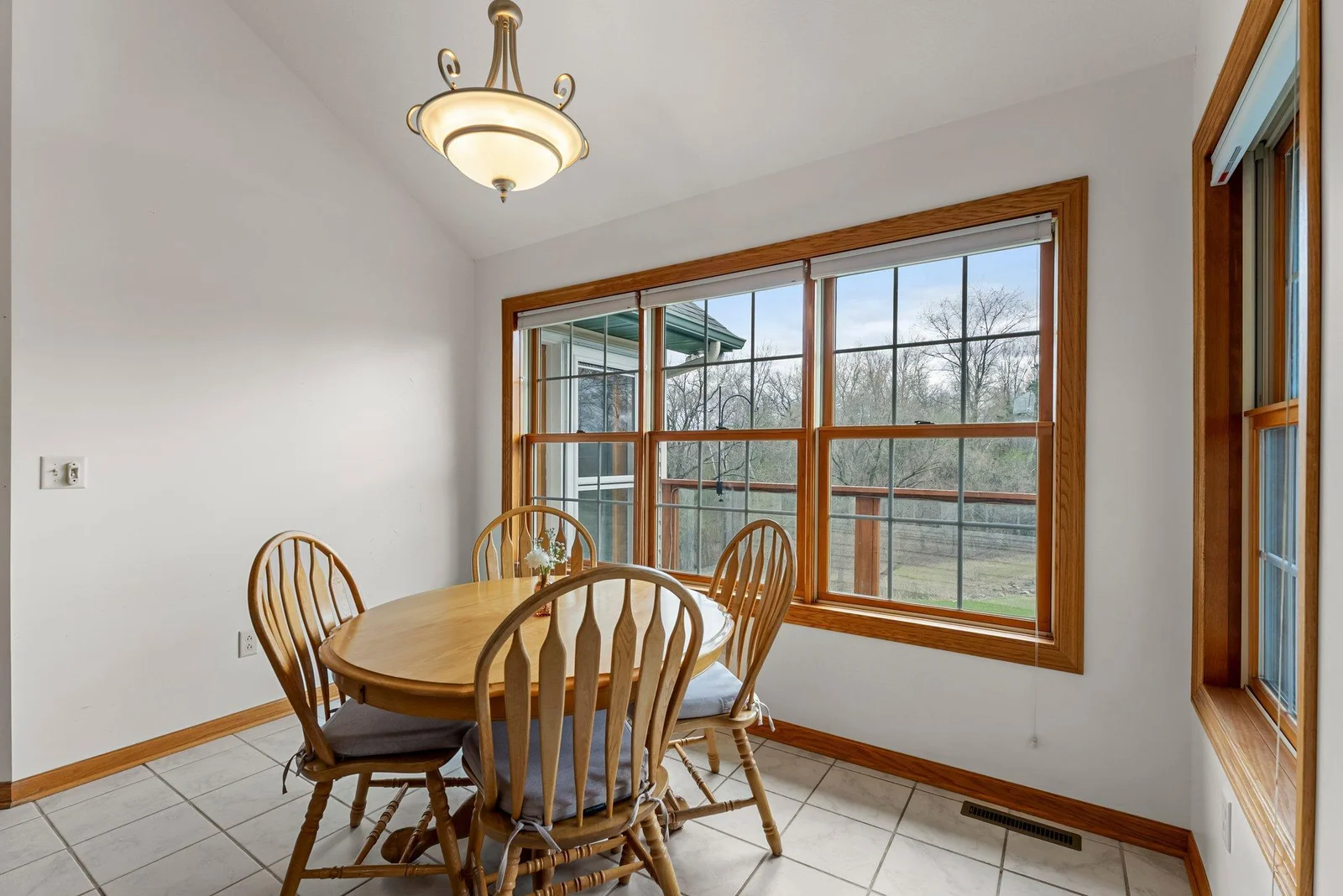 Informal dining room off kitchen, living room and deck