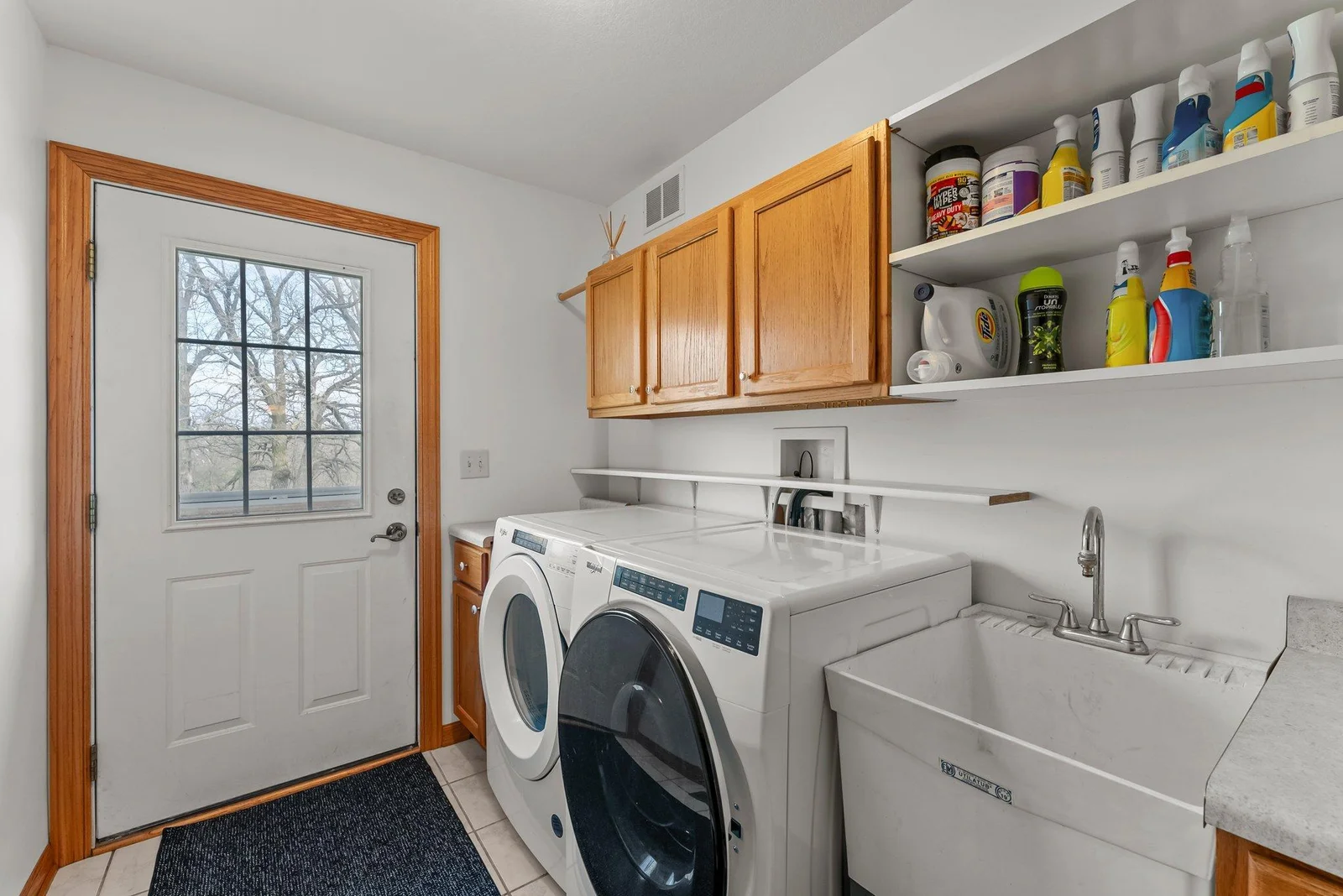 Mud/laundry room. This door leads to fully fenced in area for pets.