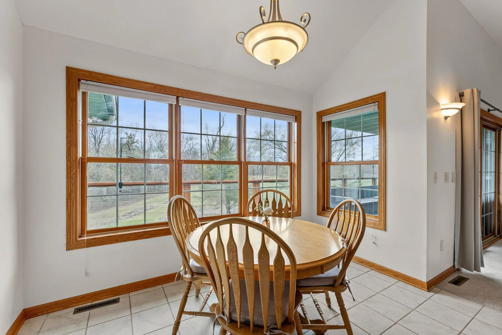Informal dining room off kitchen, living room and deck