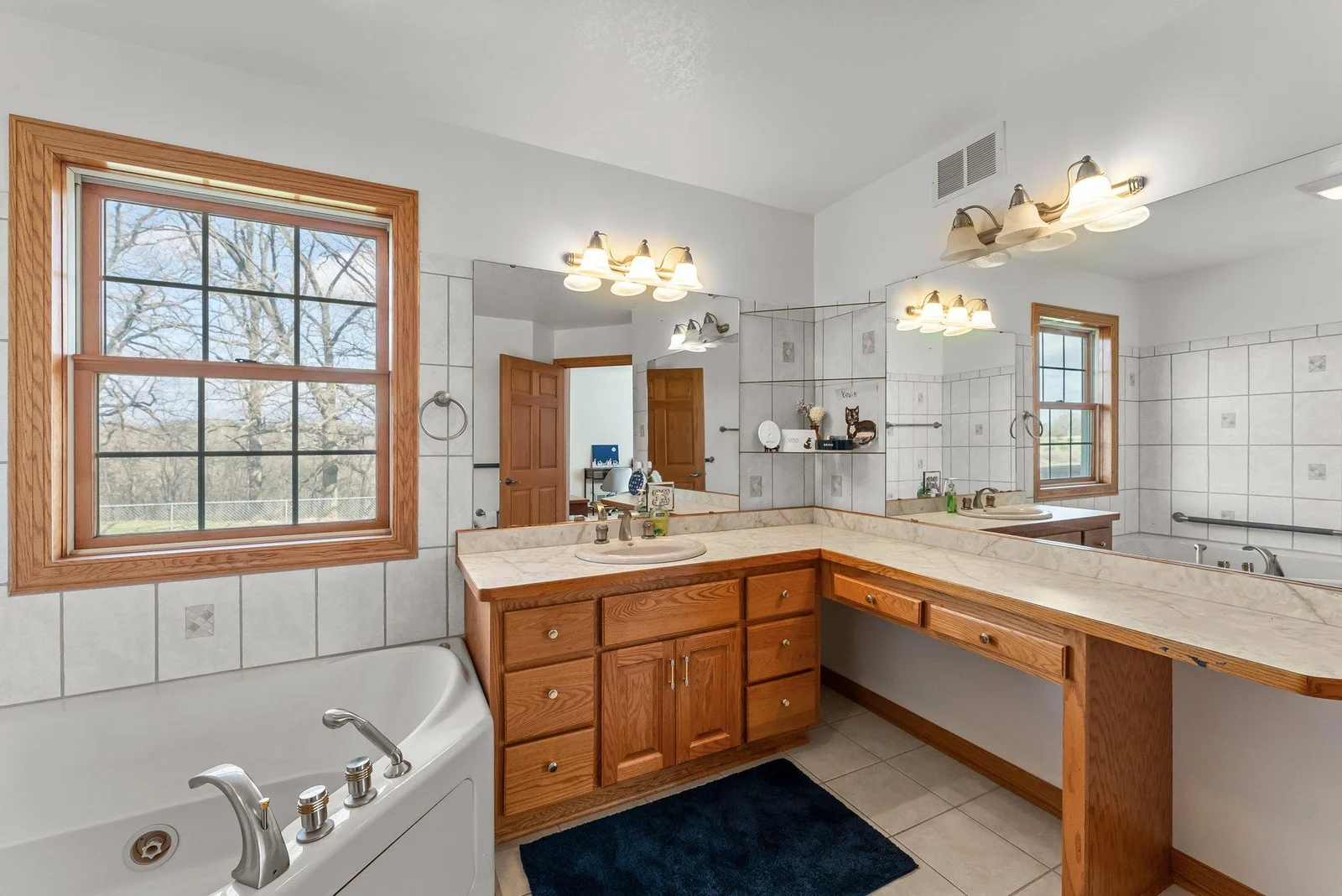 Private full bathroom off of main level first primary bedroom