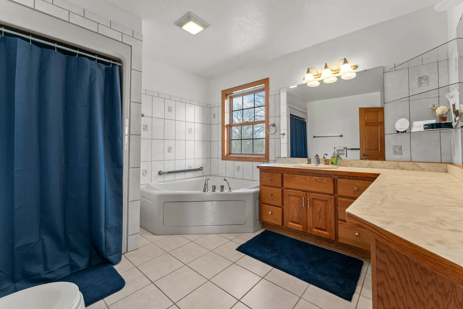 Private full bathroom off of main level first primary bedroom (aka master bathroom)