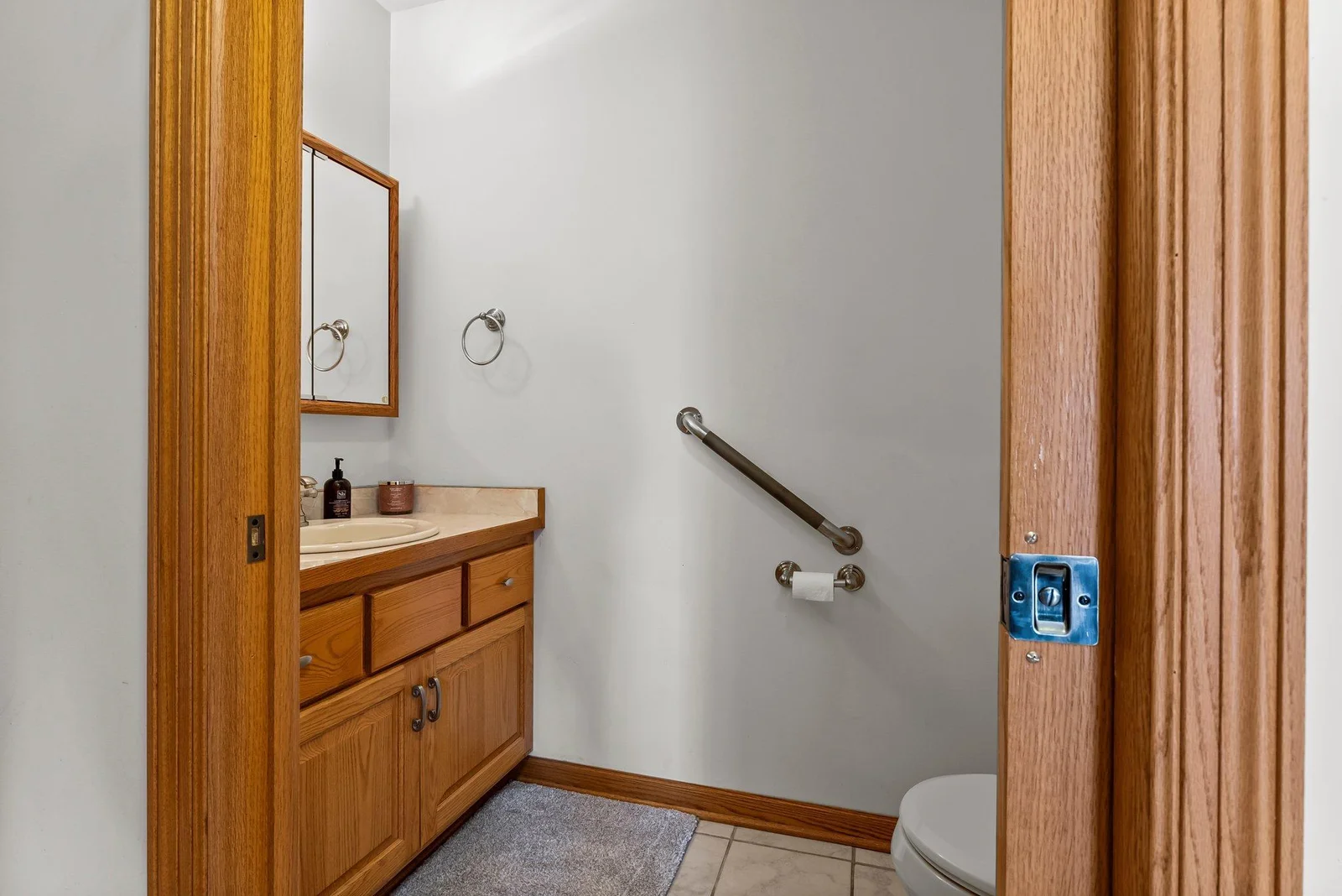 Half bathroom (sink & toilet only) off mud room/laundry room. This is also near interior garage door entrance.