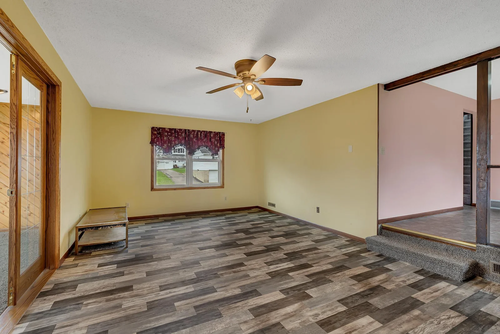 The living room also features new flooring.