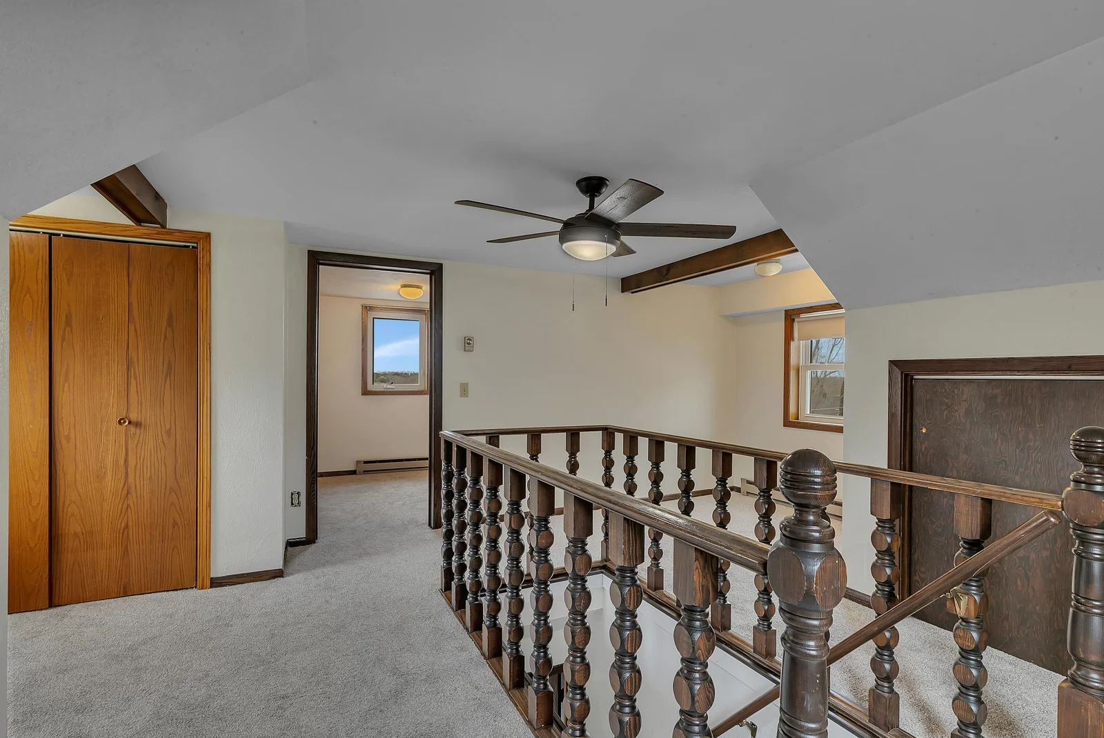 Upstairs enjoy an updated ceiling fan and lighting, paired with plush new carpeting for a cozy retreat.