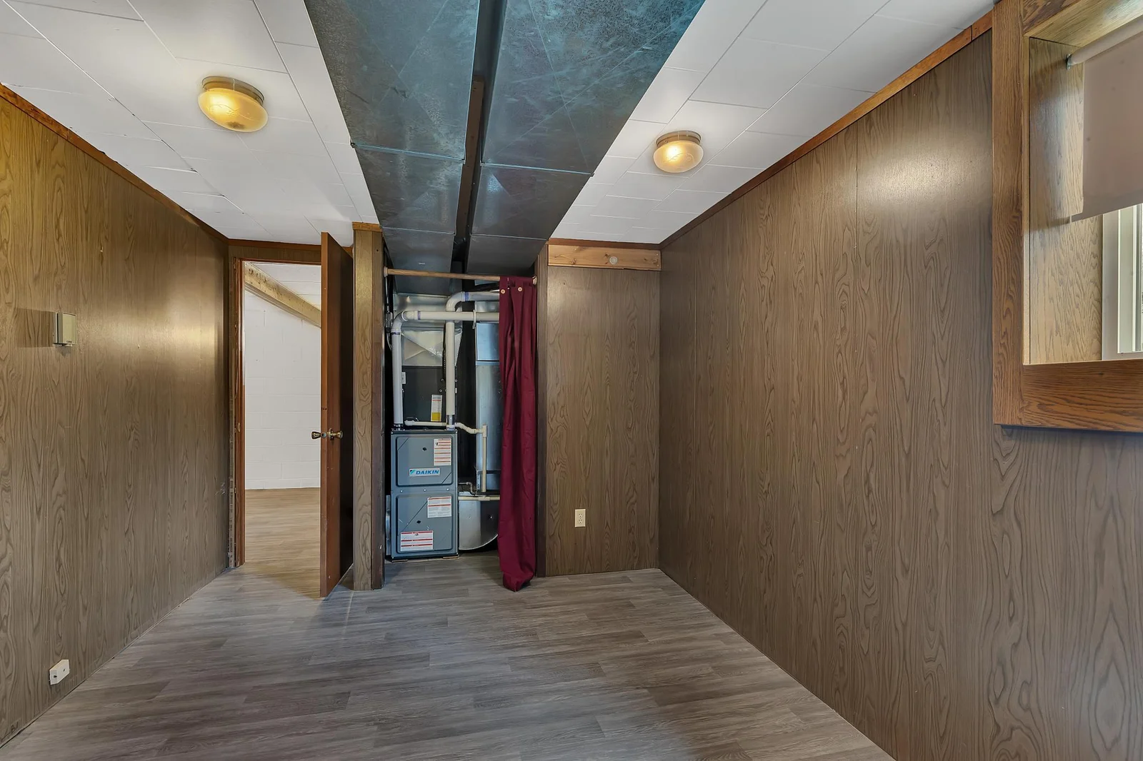 Mechanical/storage room - forced air furnace and central A/C (both new in 2020), water softener (new 2021), power-vented gas water heater (new 2015), and a 150-amp electrical panel that supports today’s modern needs.