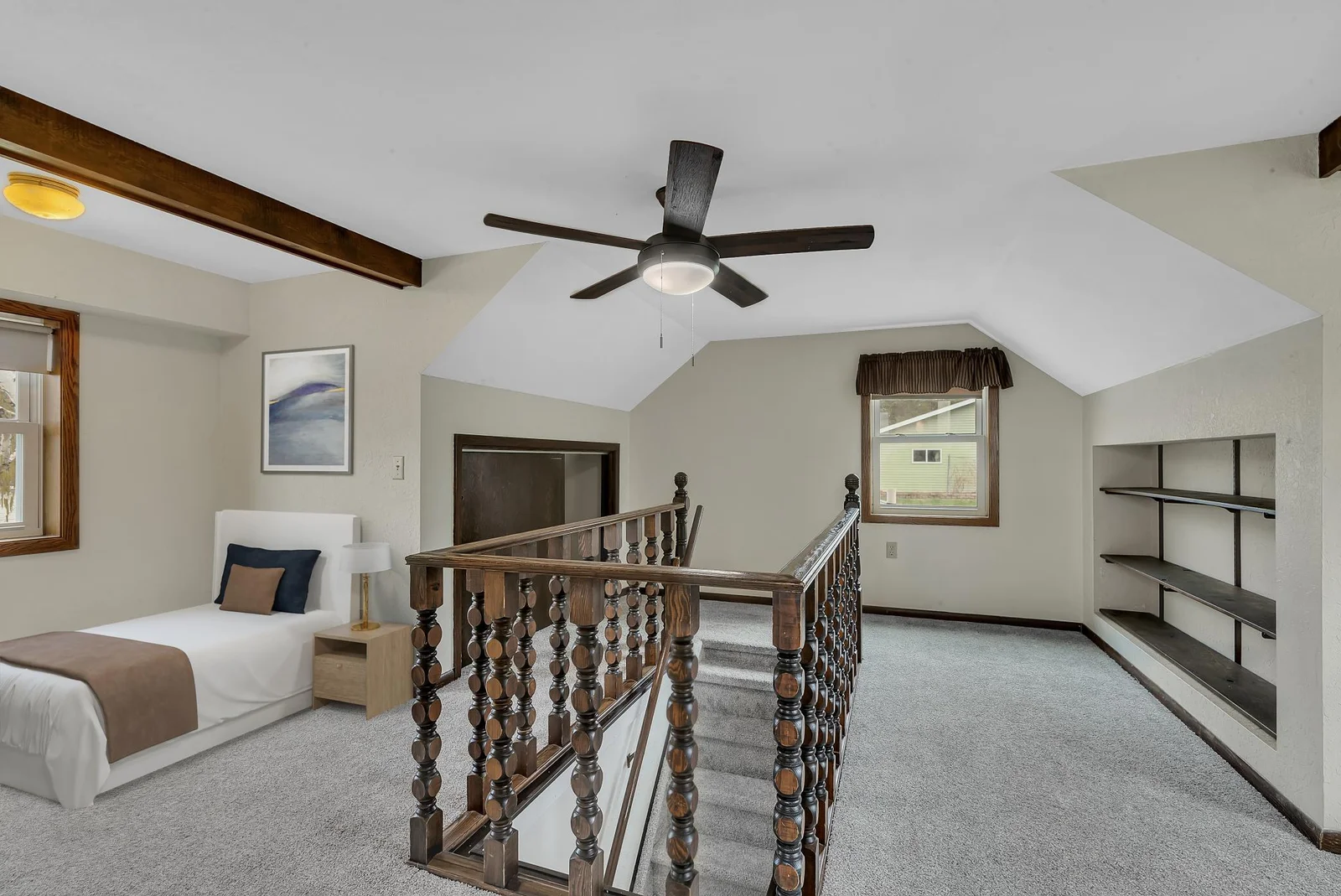 Storage at the top of the stairs, either on the open shelving or enclosed closet.