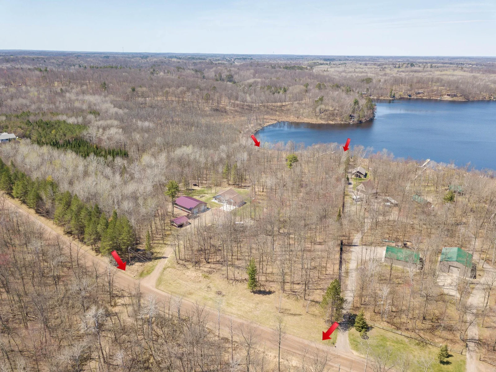 eight wooded acres, approximately 300 ft of lake shore on Long Lake