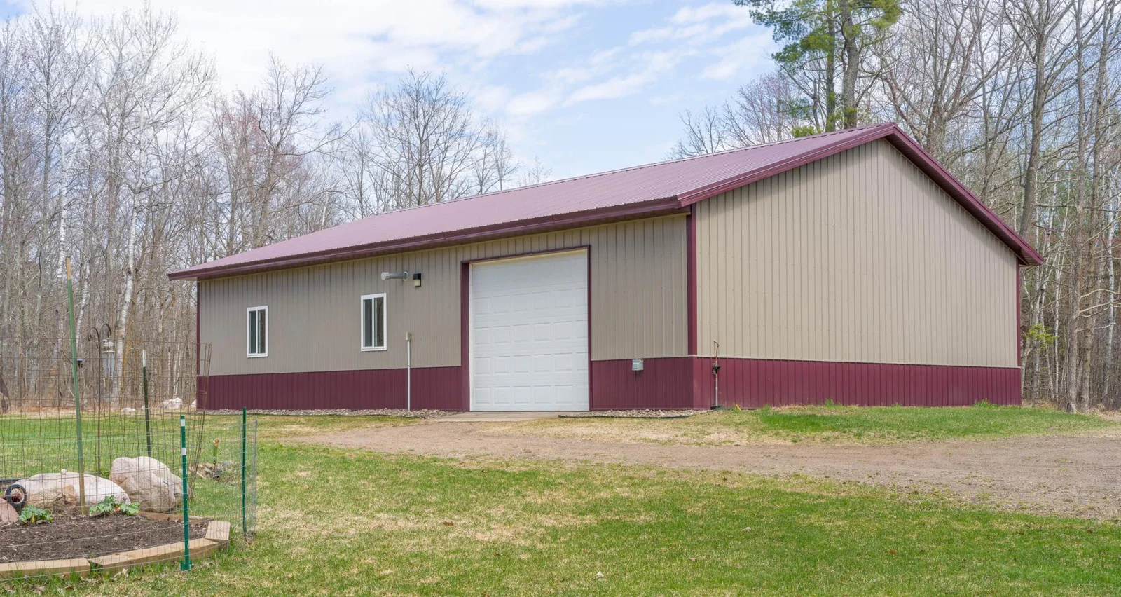 40 x 56 building has Heated Workshop (3) - 12 × 10 Ft Garage Doors (2 with openers)