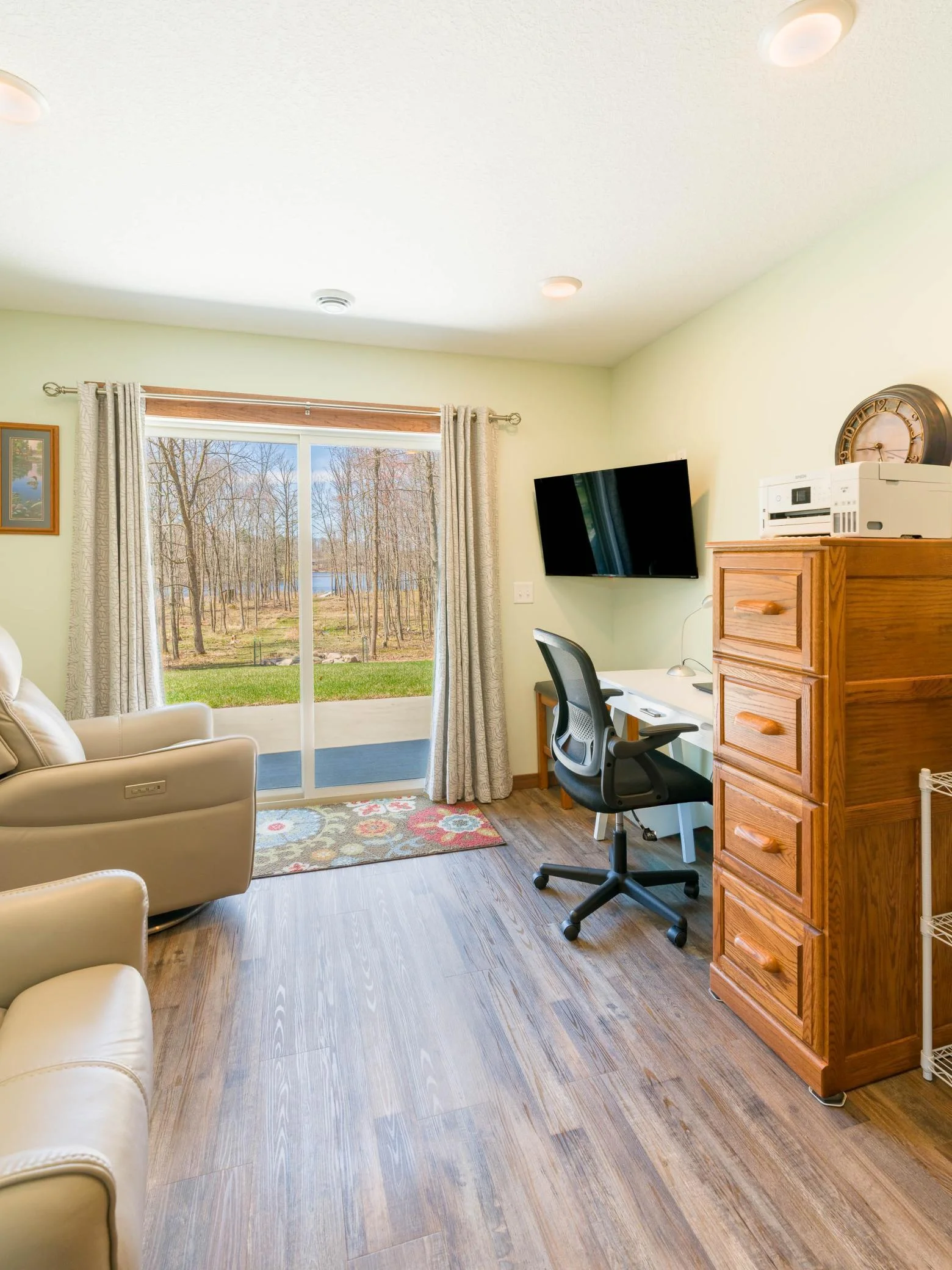 Office den with sliding door to patio on the lake side of home.