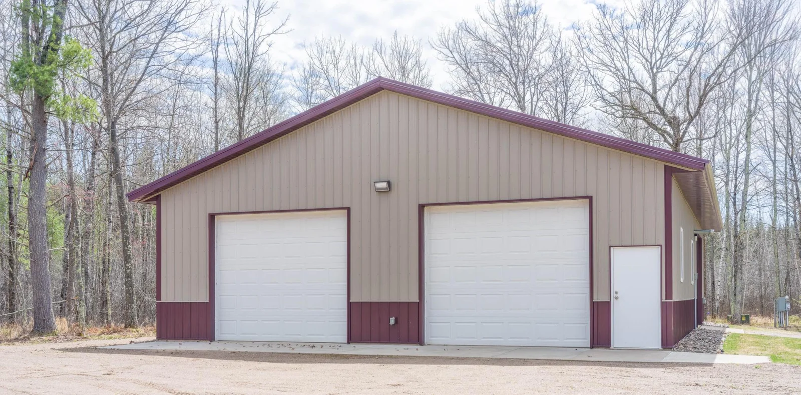 40 x 56 building has Heated Workshop (3) - 12 × 10 Ft Garage Doors (2 with openers)