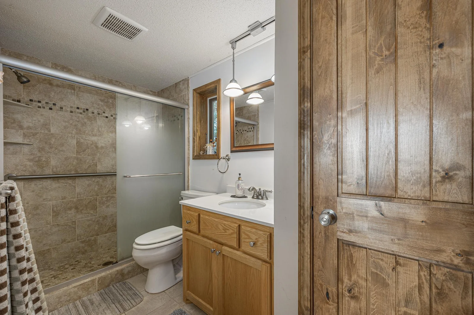Upgraded main floor bathroom with tile shower.