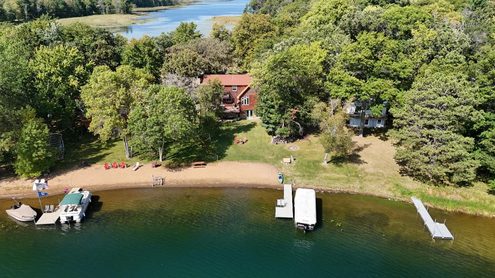 Aerial view of the home and sandy beach.