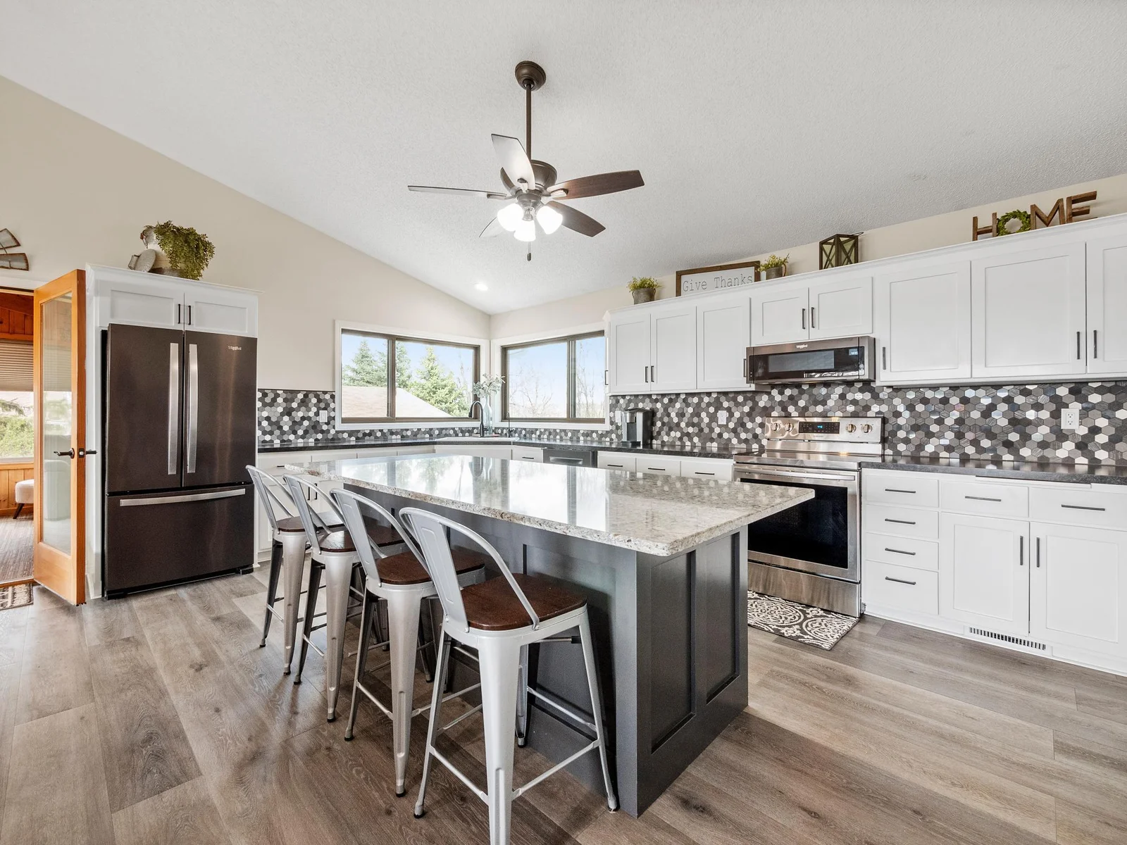 An expansive 10-foot granite island serves as the centerpiece of the home, combining style and function.