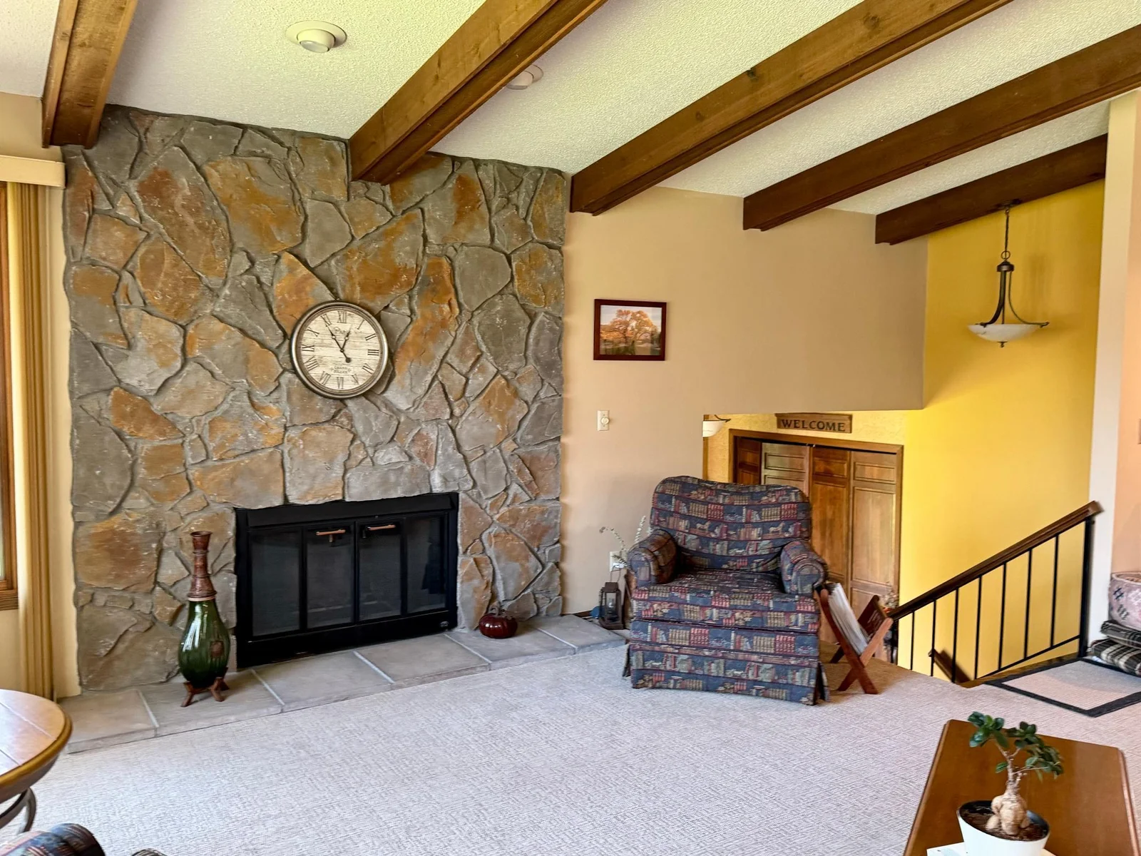 Dramatic stone fireplace.