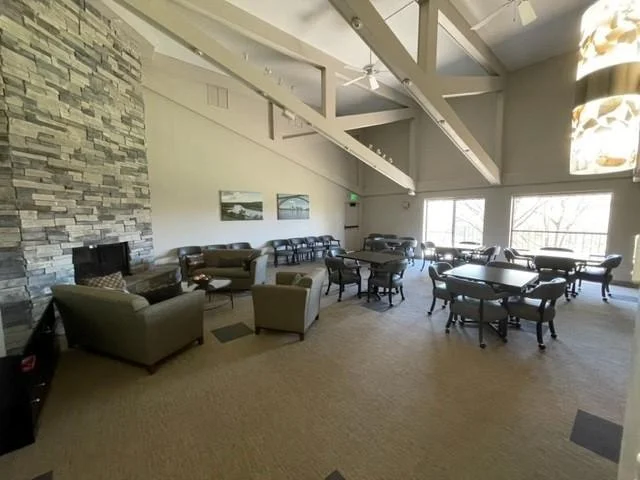 spacious community room with fireplace and