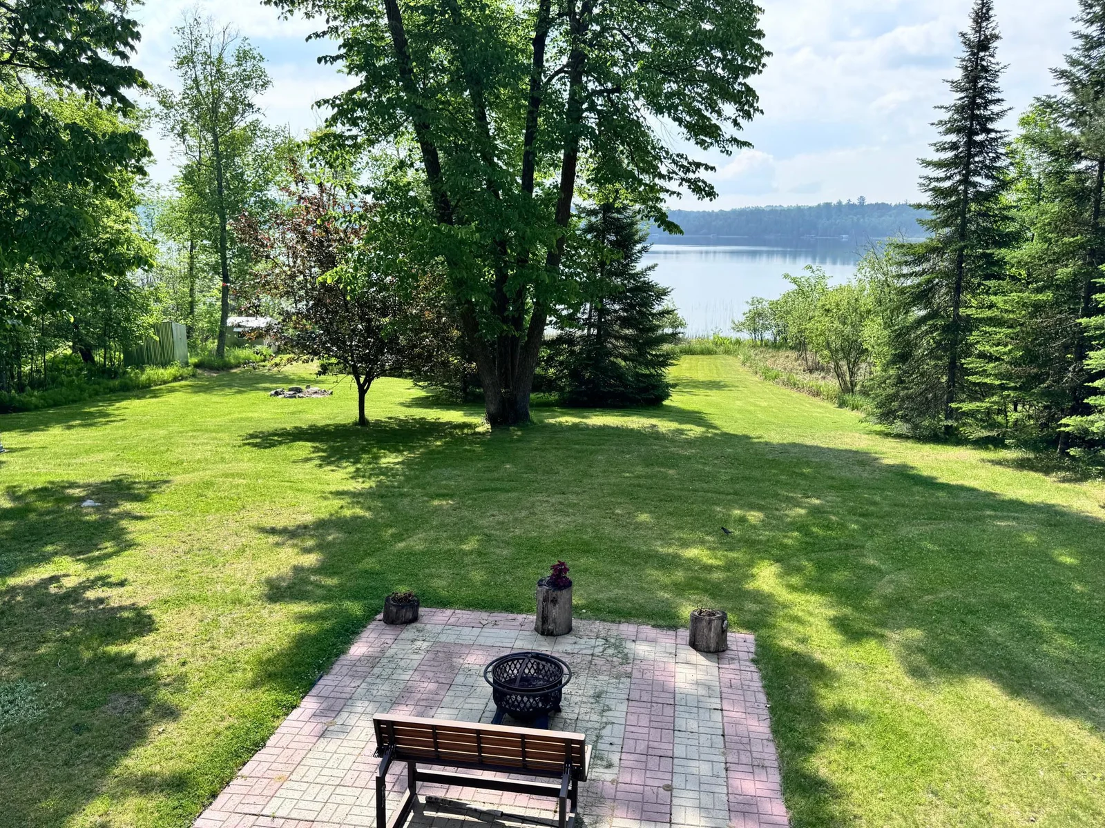 Enjoy the paver patio located near the waters edge.