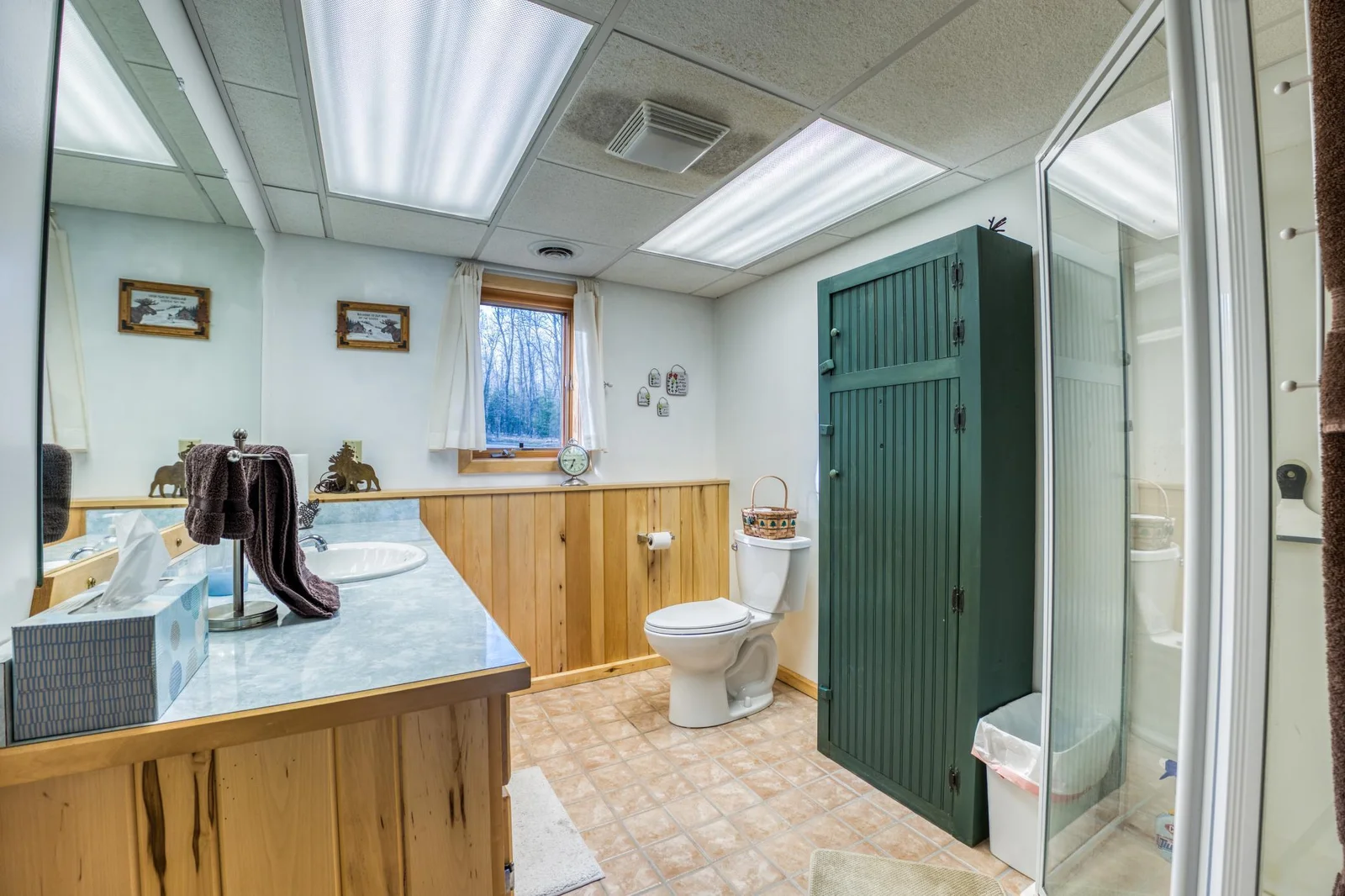 Lower level bathroom is just steps away from the door out to the lake