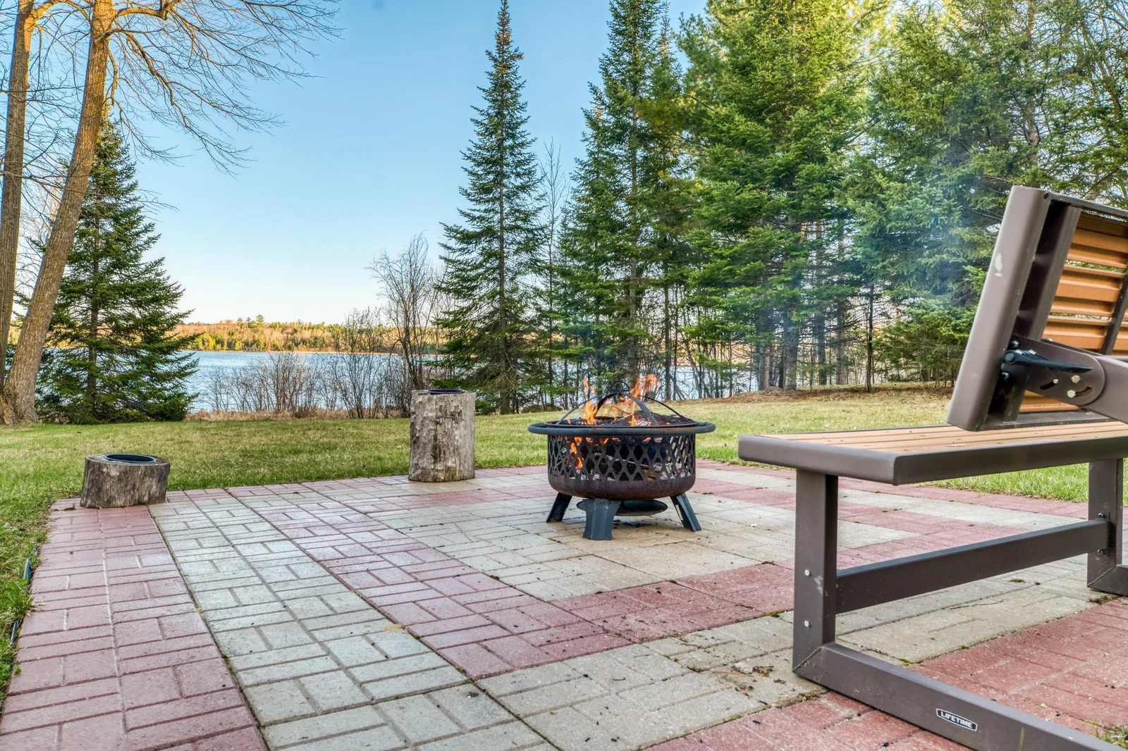 The paver patio is near the waters edge