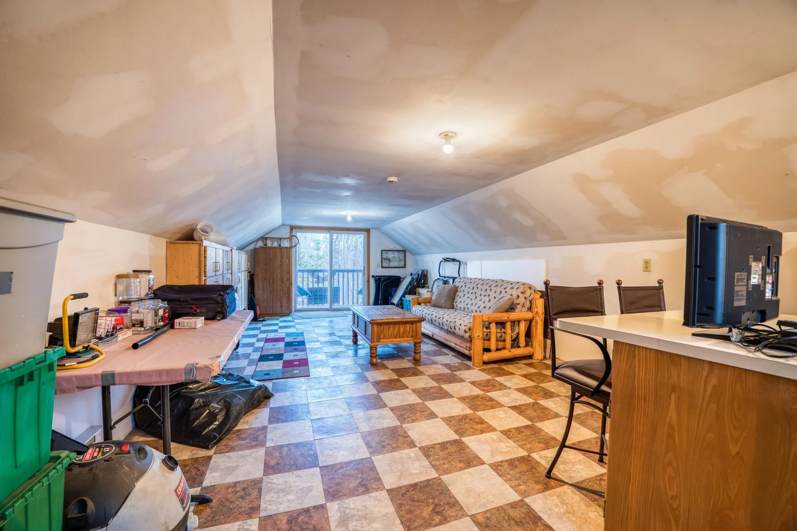 Bonus space above the garage- currently used as extra sleeping space. Would also be a great studio, workshop, craft room or game room