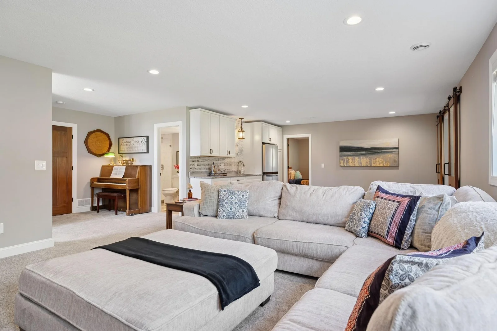 The rec room area is huge! Look at all these recessed lights and the gorgeous wet bar.
