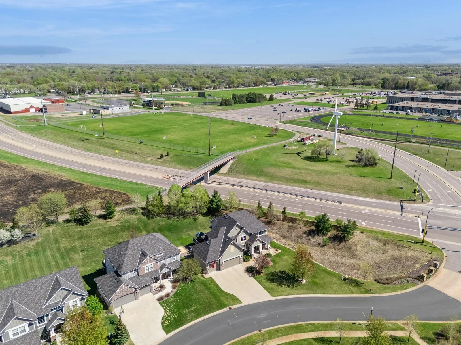 Here you can see that there is a walking bridge across Bunker Lake Blvd, which leads to Castle Field for baseball, the Anoka Ice Arena for hockey and Anoka High School for school, and track & field.
