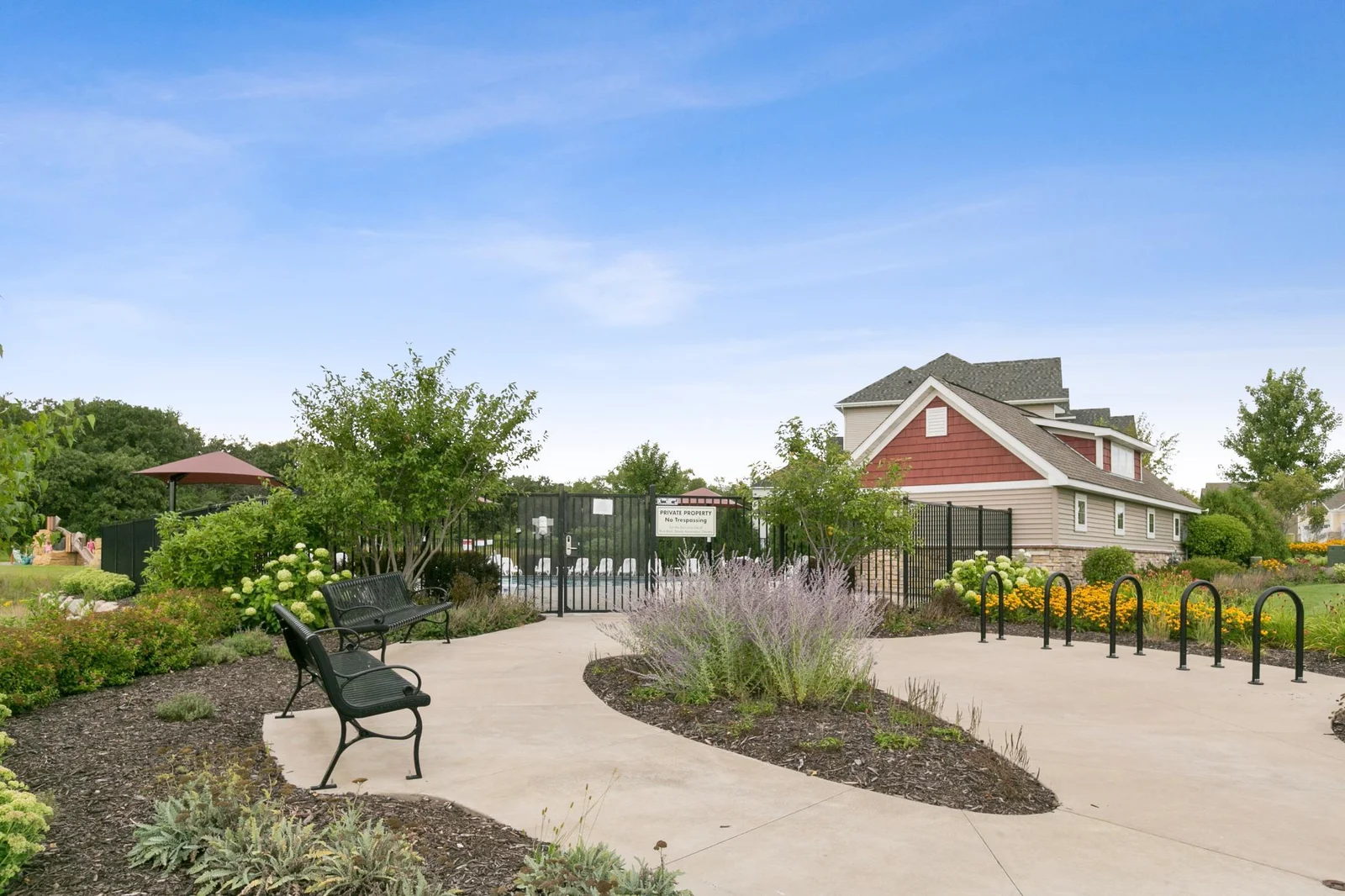 The Rum River Shores neighborhood pool has nice landscaping, bike locking stations and benches.