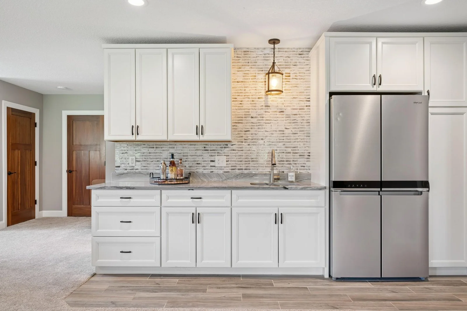 The Diamond brand custom cabinets have full-extension, solid pine drawers with dove-tail connections and soft-close hardware. The full-size fridge is included. The backsplash is marble tile. Wow. Just wow.