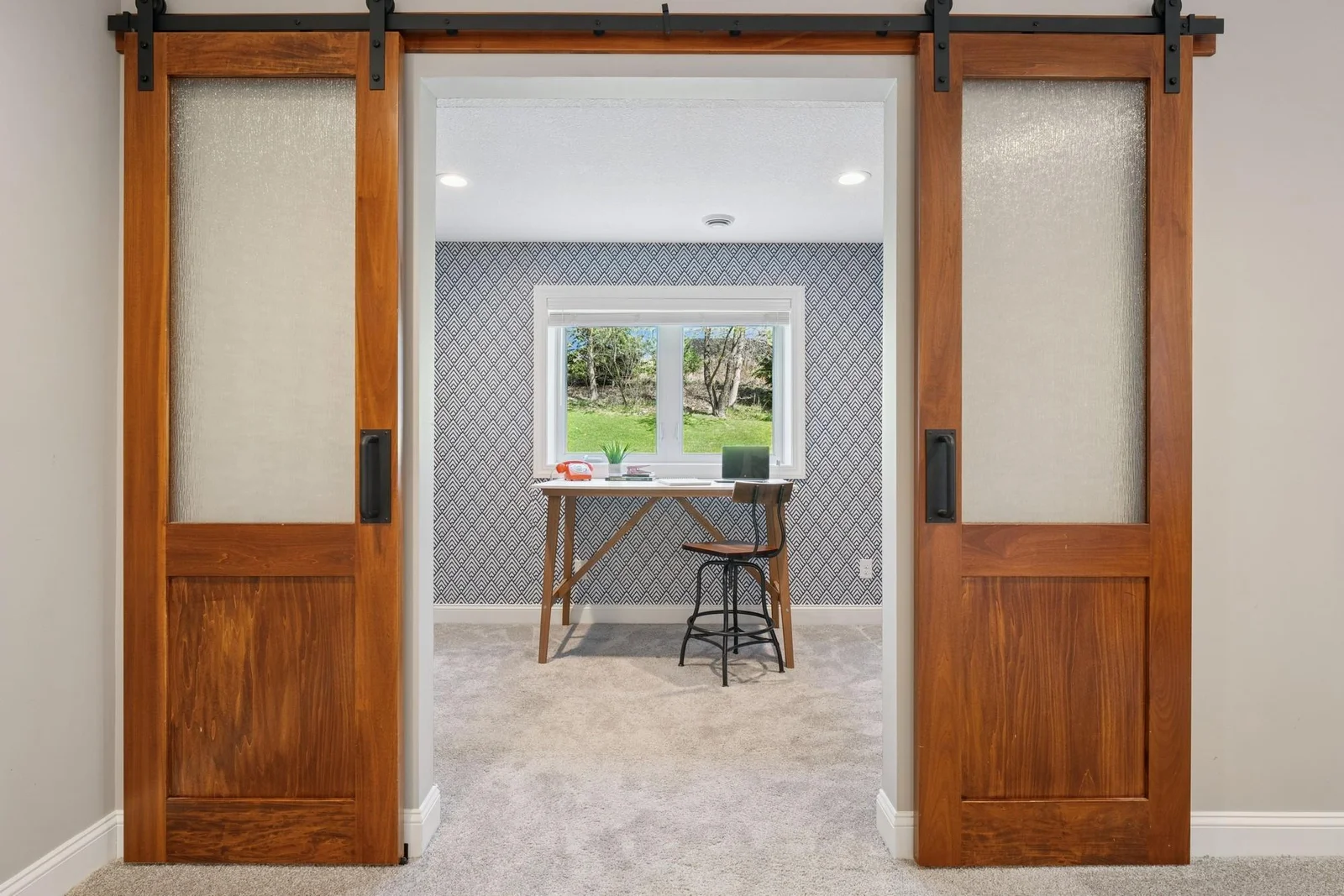 These sliding barn doors have custom, translucent, textured glass.