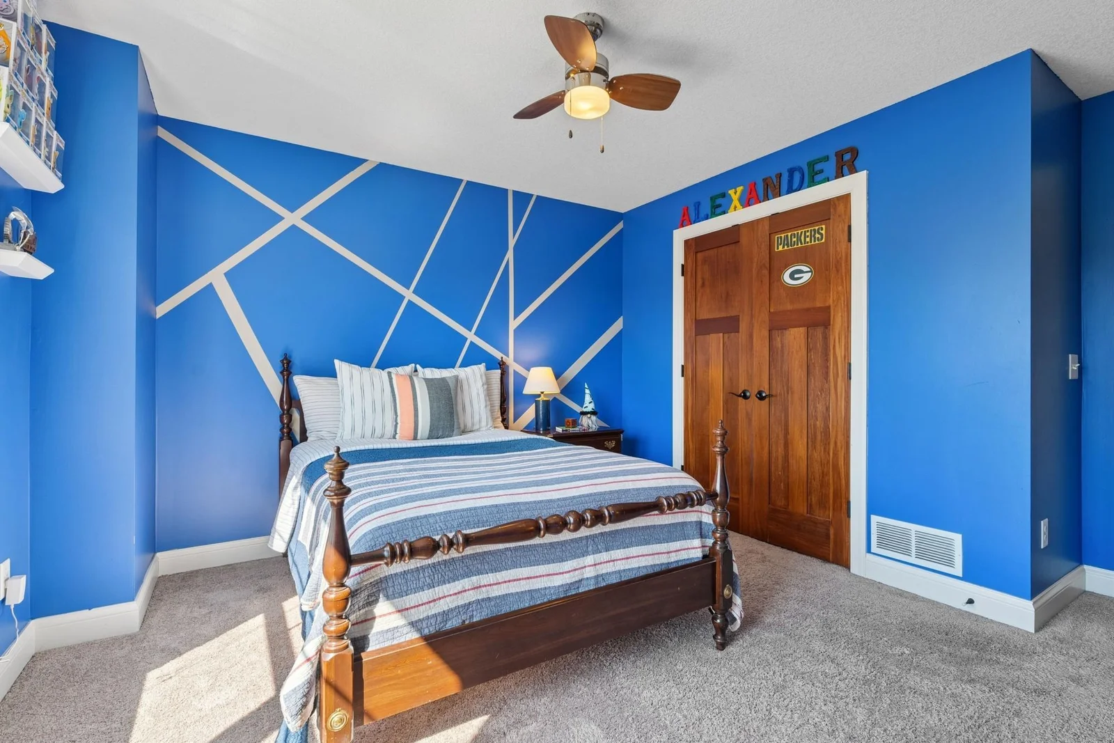 This bedroom has a ceiling fan too. Excuse the Green Bay Packers logo.