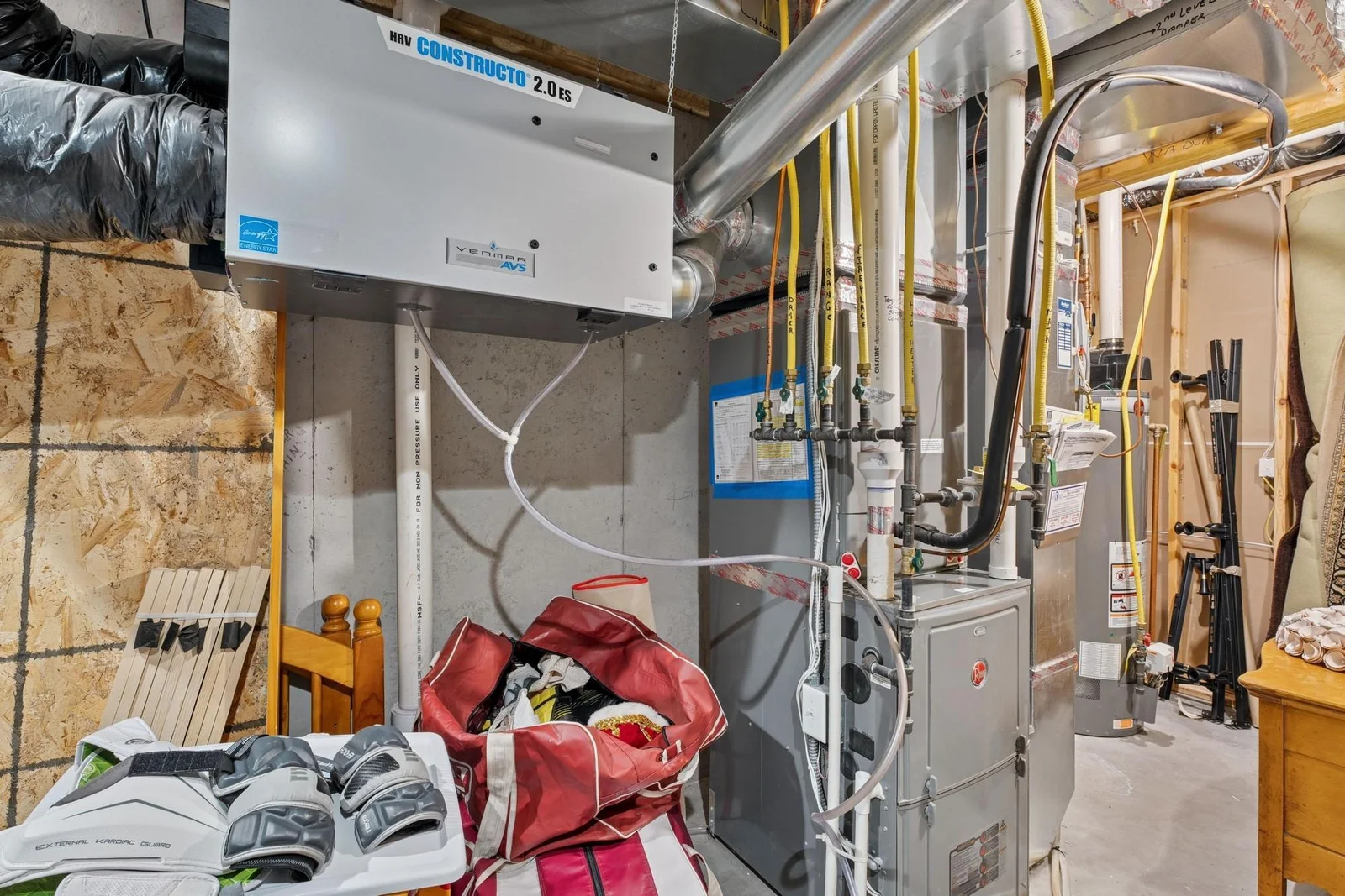 The furnace is a high-efficiency, sealed combustion model. It also has a duct-mounter humidifier. The gas water heater is power vented too!