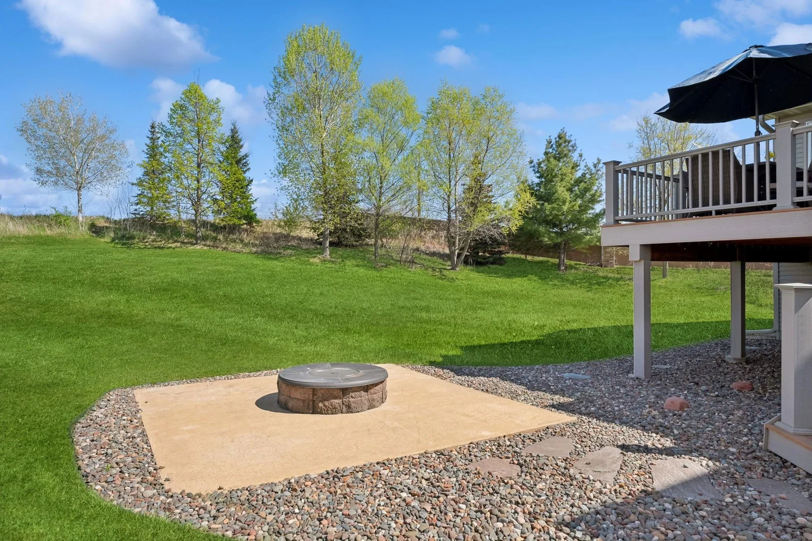 The stamped patio features a built-in fire pit. Also, again, notice what's not there - other homes!