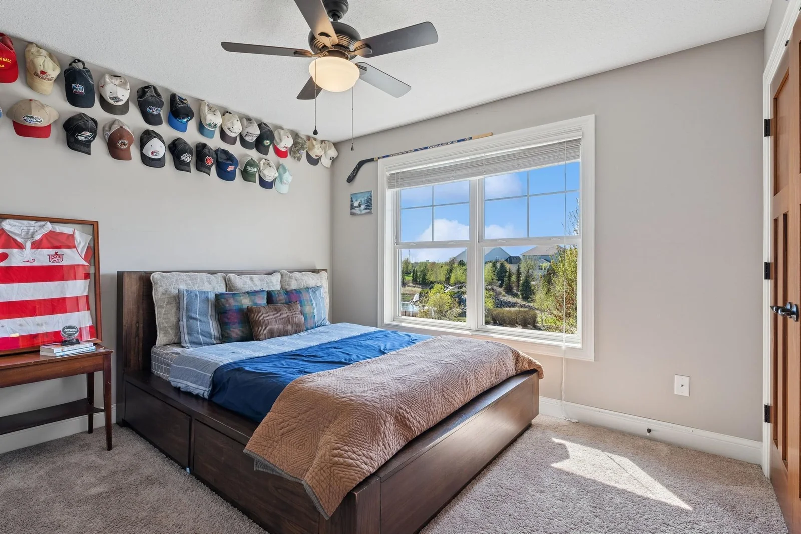 Bedroom #2 of 4 on the upper level also features a ceiling fan. This bedroom and bedroom #3 share a Jack & Jill bath.