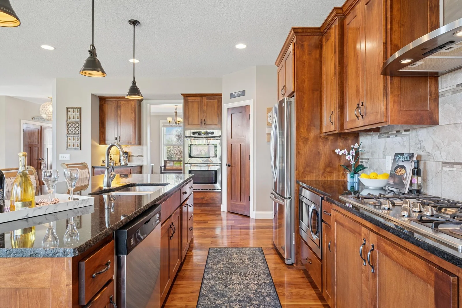 From here you can see that the microwave is built-in, allowing for the heavier-duty vent above the cooktop, as well as not having to put the microwave on the countertop.