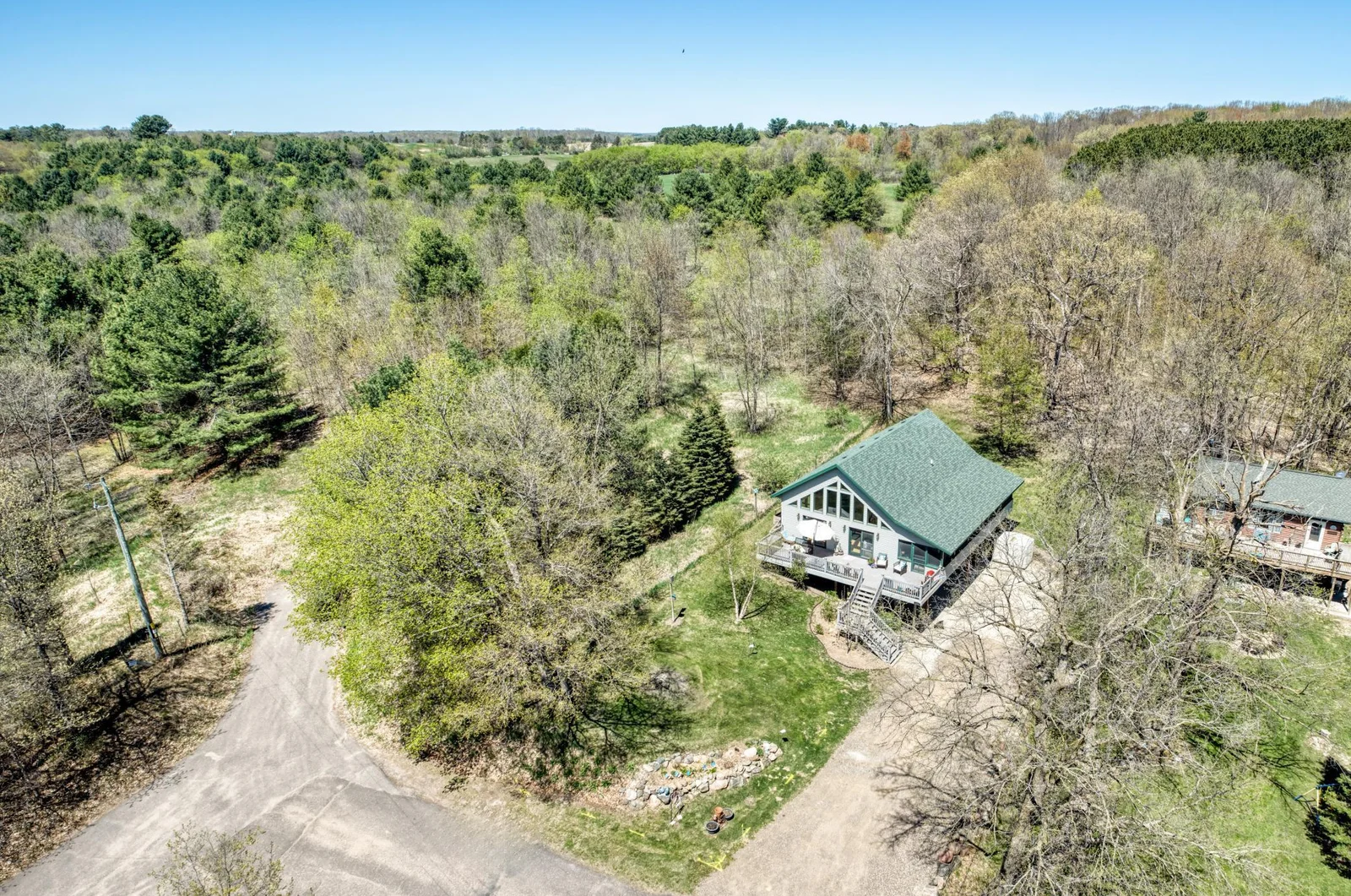 Mature trees and plenty of green space surround this charmer.