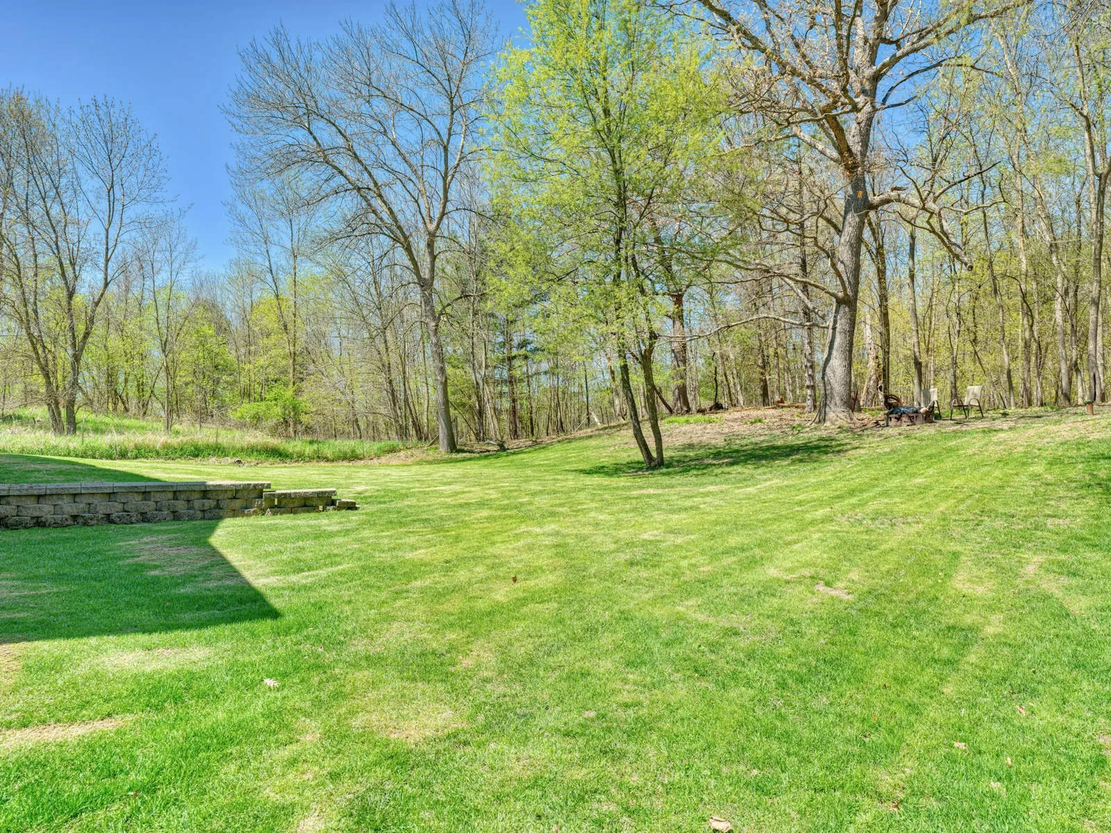 Plenty of backyard space with a private fire pit area.
