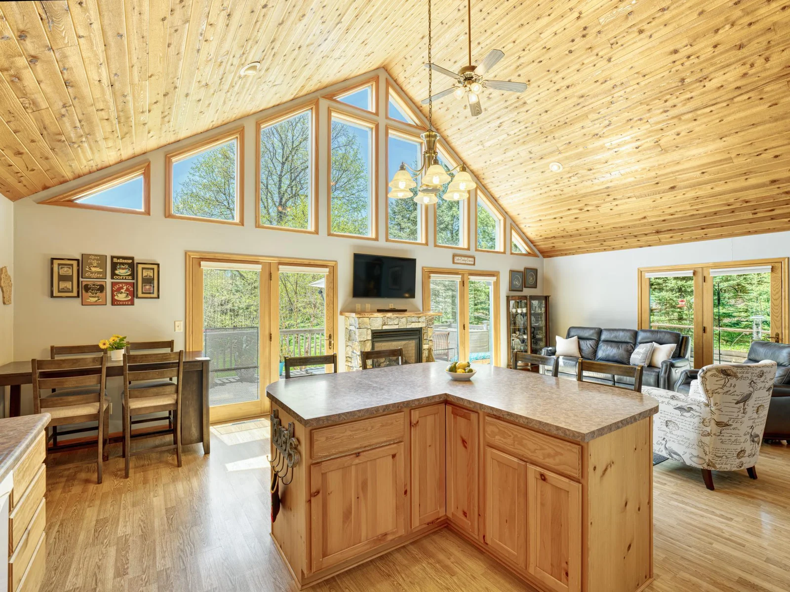 Informal kitchen dinette area is conveniently located within steps of your open front deck or escape into the side screened porch area for those big lake gathering meals.