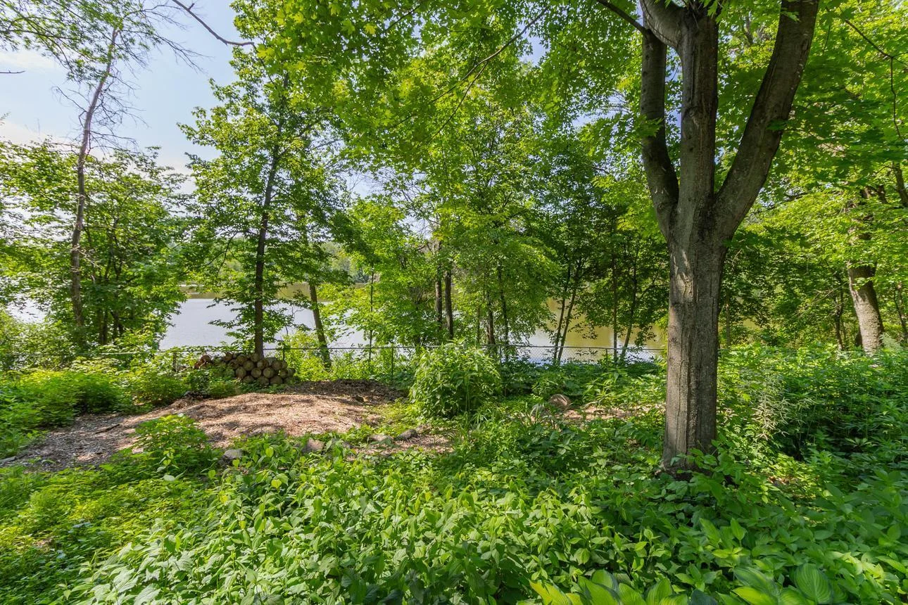 The wooded privacy of a northern MN cabin right here in Apple Valley.