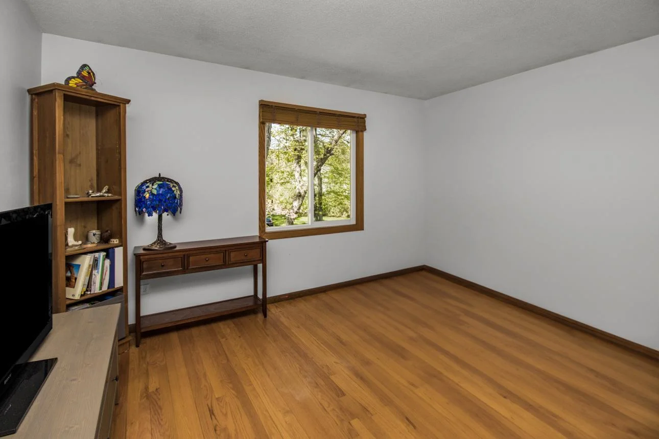 One of two bedrooms on the main level - good light and hardwood floors!