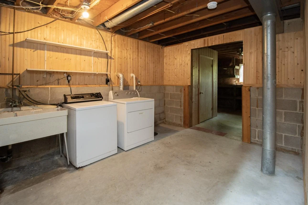 Unfinished laundry affords tons of storage!