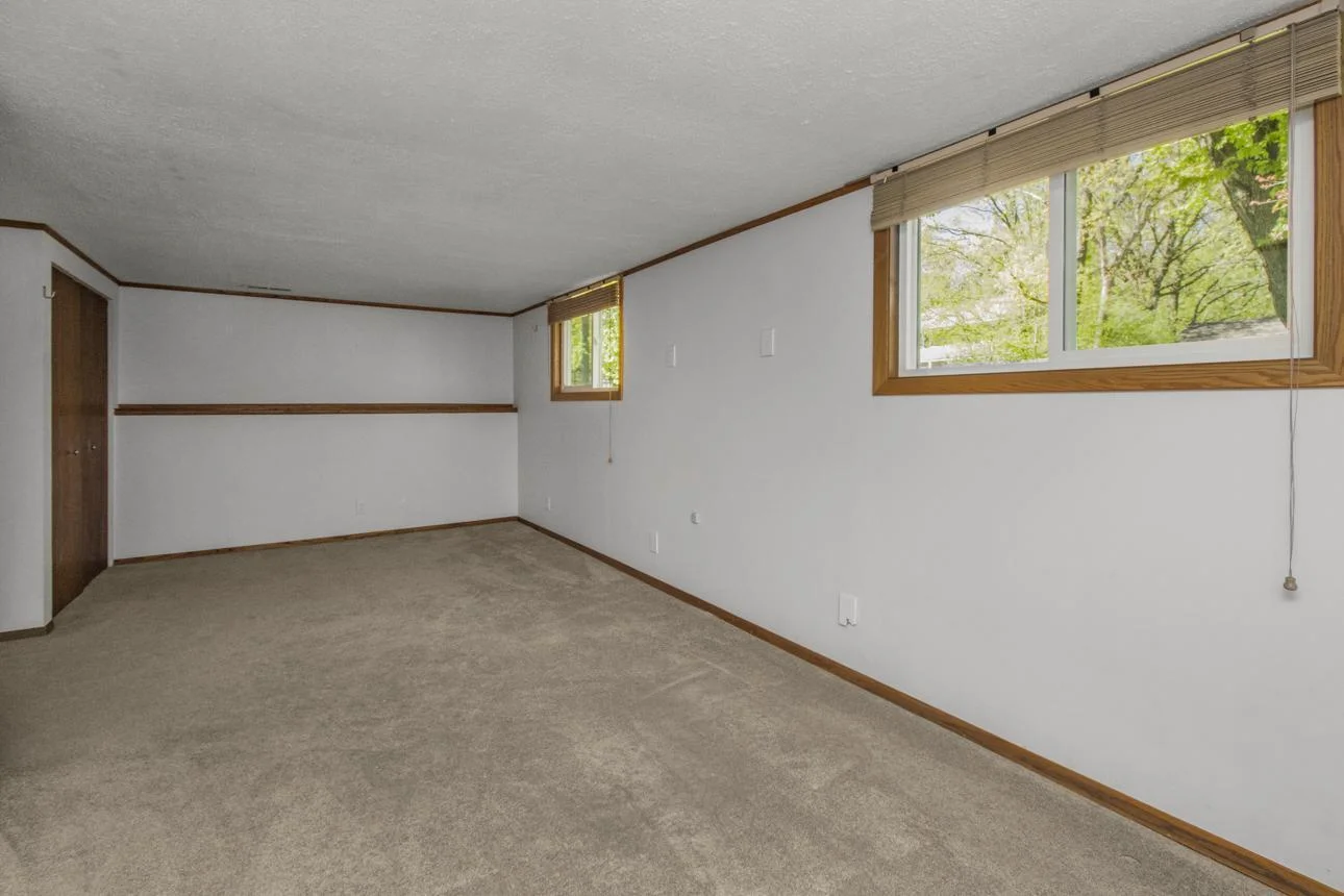 Lower level bedroom from opposite end - second closet and lots of light.  Big enough to be two bedrooms with the right plan!