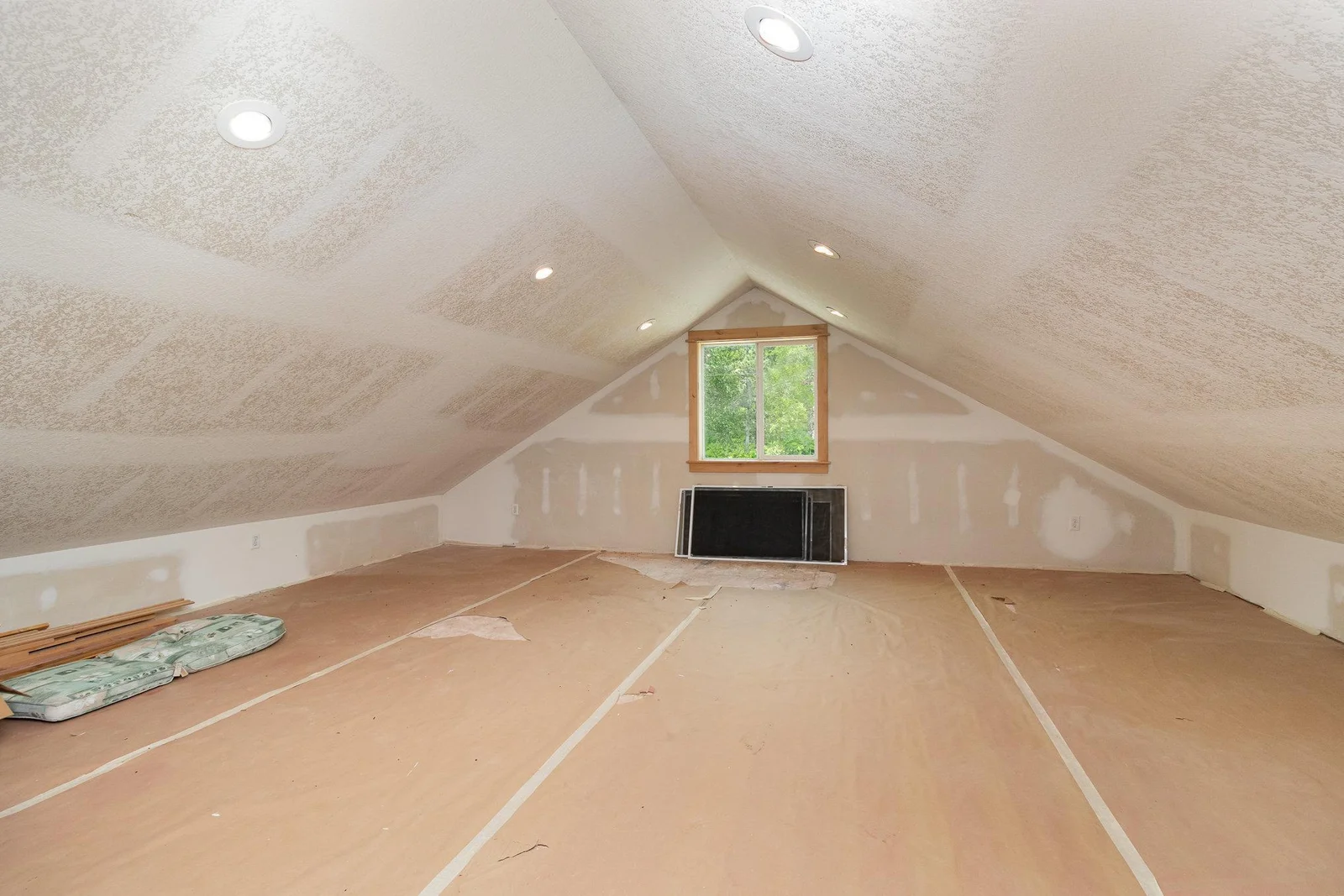 Large above attached garage storage space. Could be used as a game room or play room.